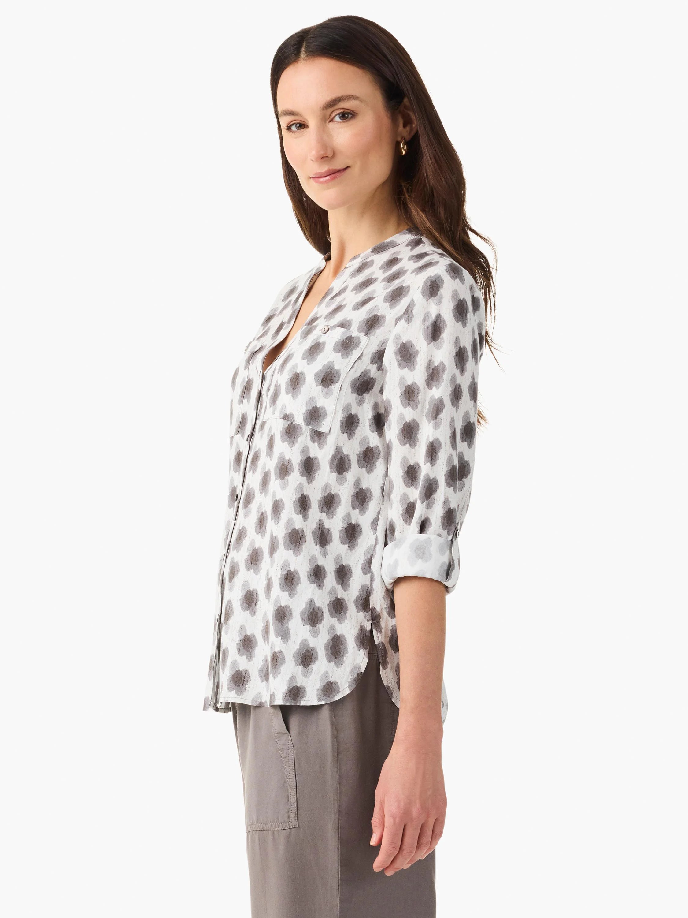 White shirt with gray & taupe clover stamp pattern. Features V-neck, button front, rolled sleeves, and chest pockets.