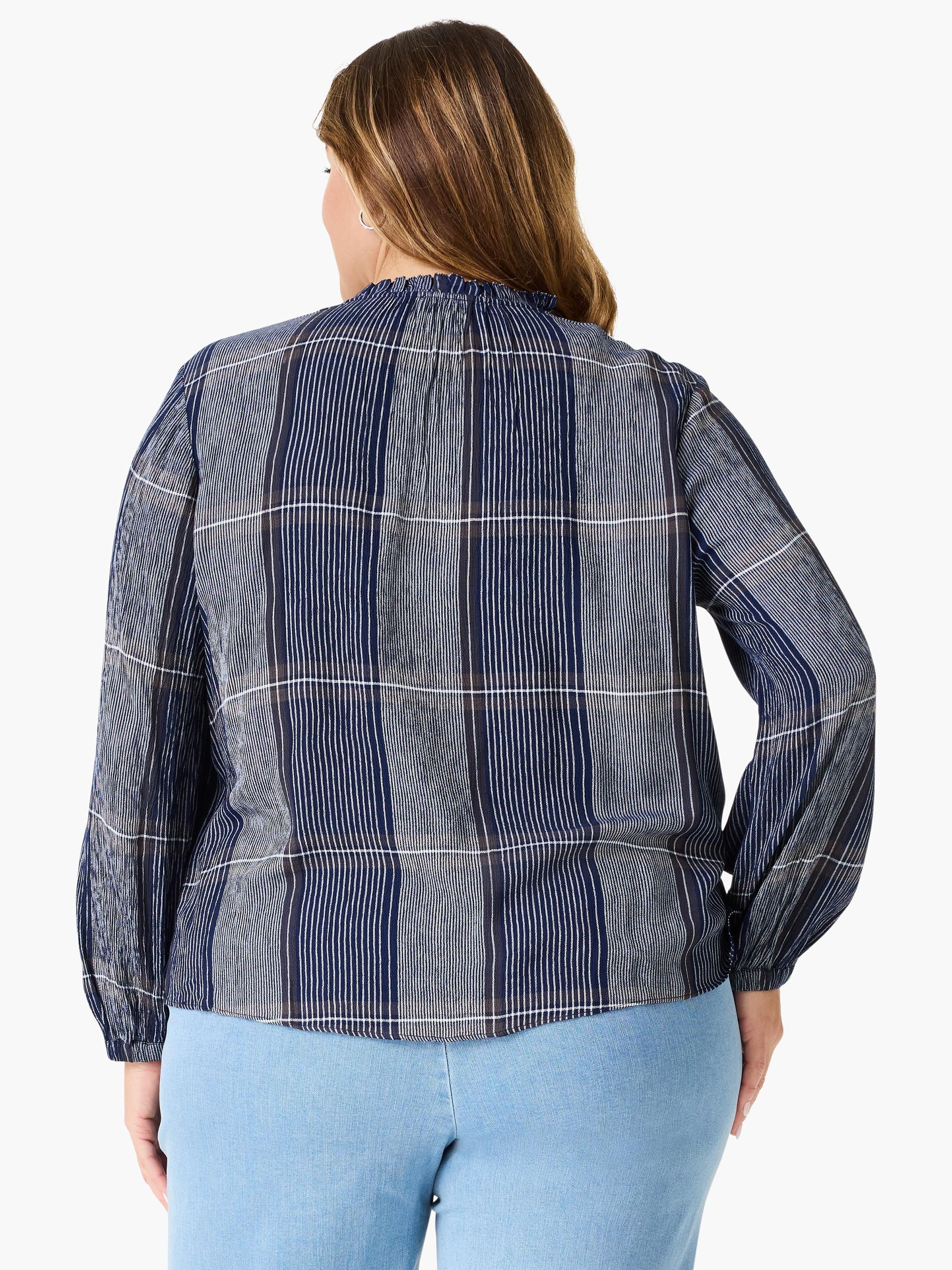 Here's alt text under 125 characters:
"Navy blue and white vertically striped blouse with long sleeves and a ruffled...
