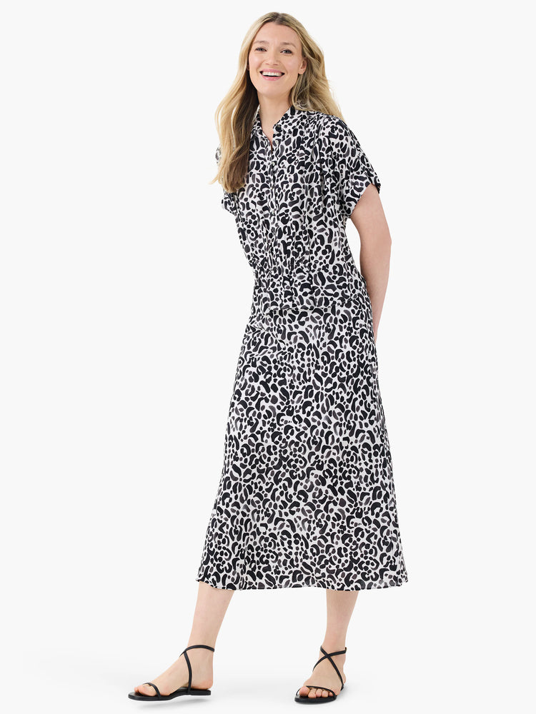 Onyx animal print midi skirt. Black and off-white abstract pattern on a flowing, A-line silhouette.