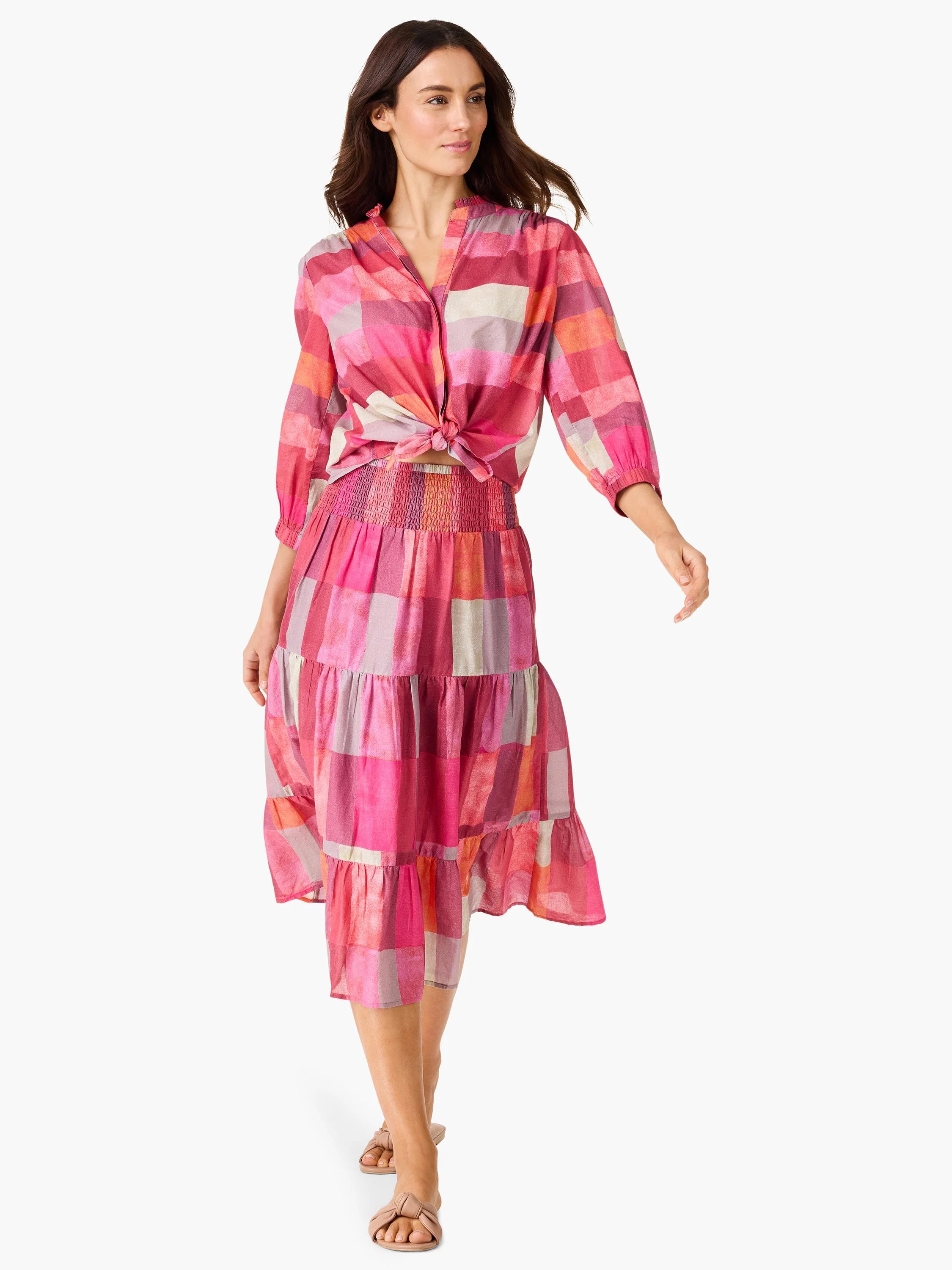 Midi tiered skirt in pink, orange, and purple plaid. Elastic waistband.