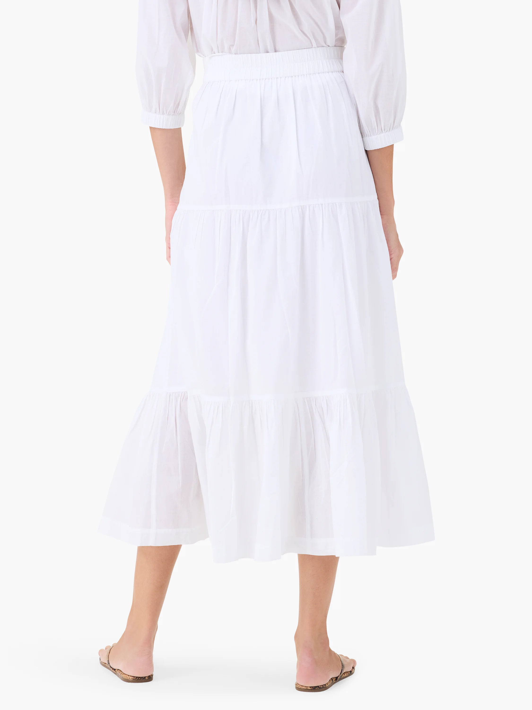 White cotton tiered midi skirt; elasticized waist. Three tiers.