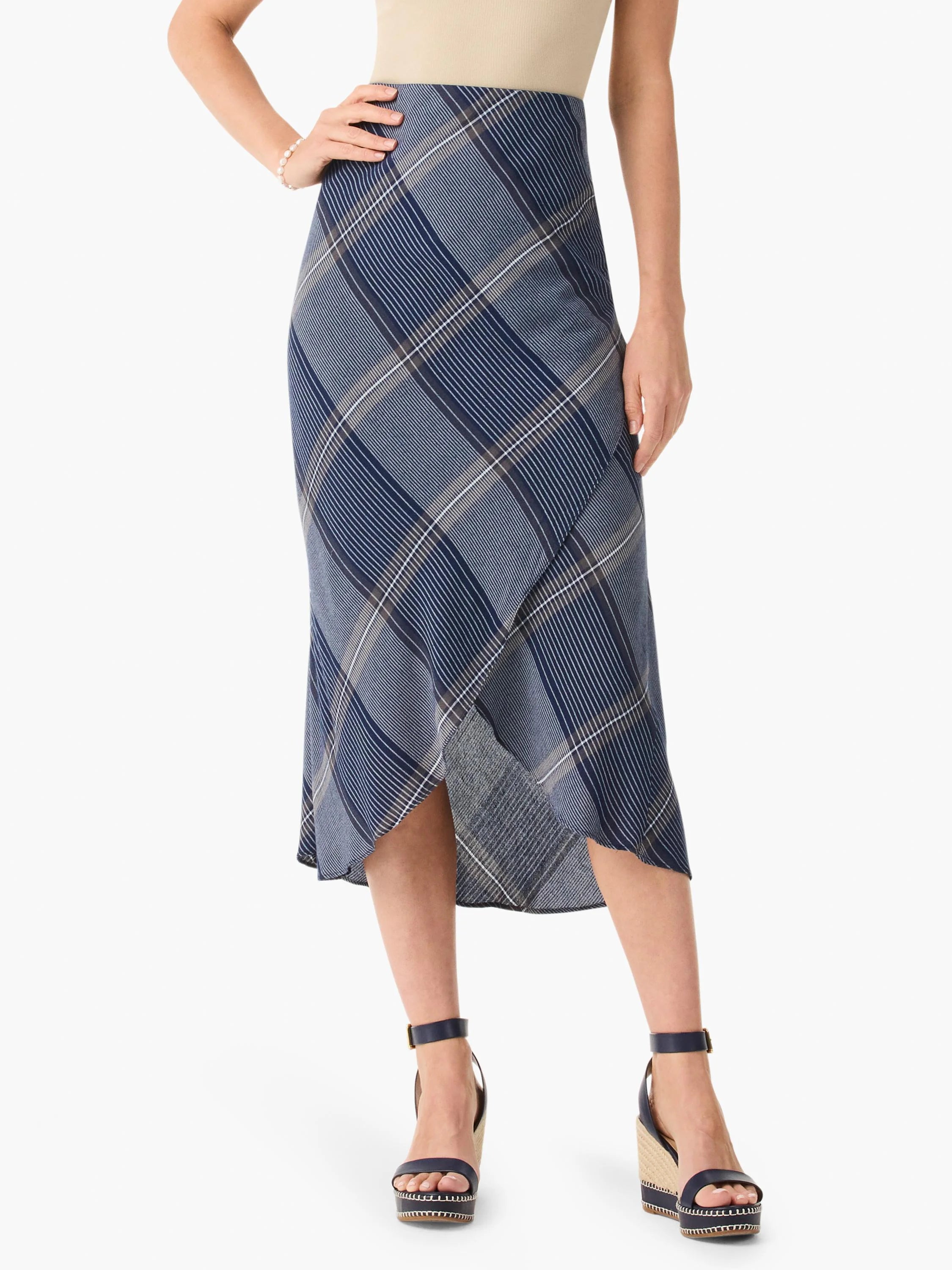 Midi-length skirt, blue and white plaid pattern, asymmetrical hemline.
