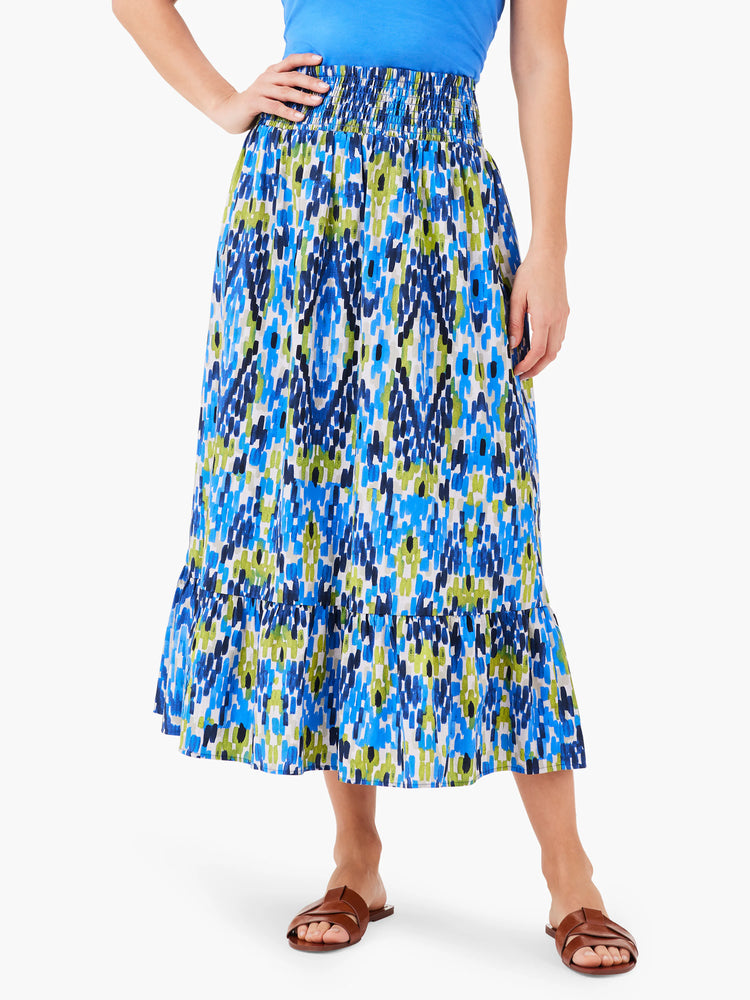 Midi-length skirt, elastic waistband. Blue, green, and white abstract print. Ruffled hem.