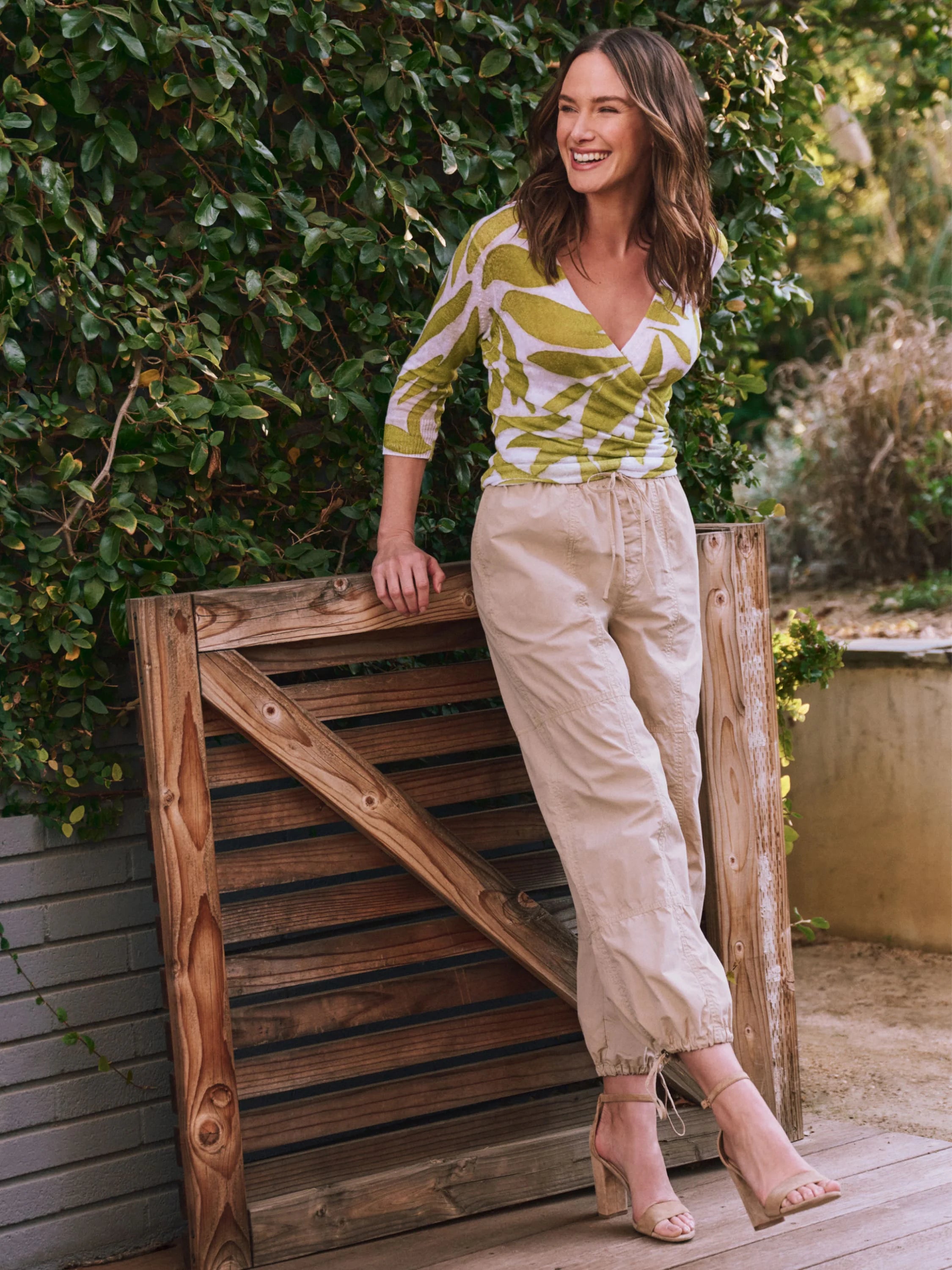 Beige ankle-length pants with drawstring waist, shown on a model.
