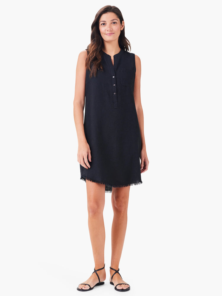 Black sleeveless linen dress, button placket, frayed hem.