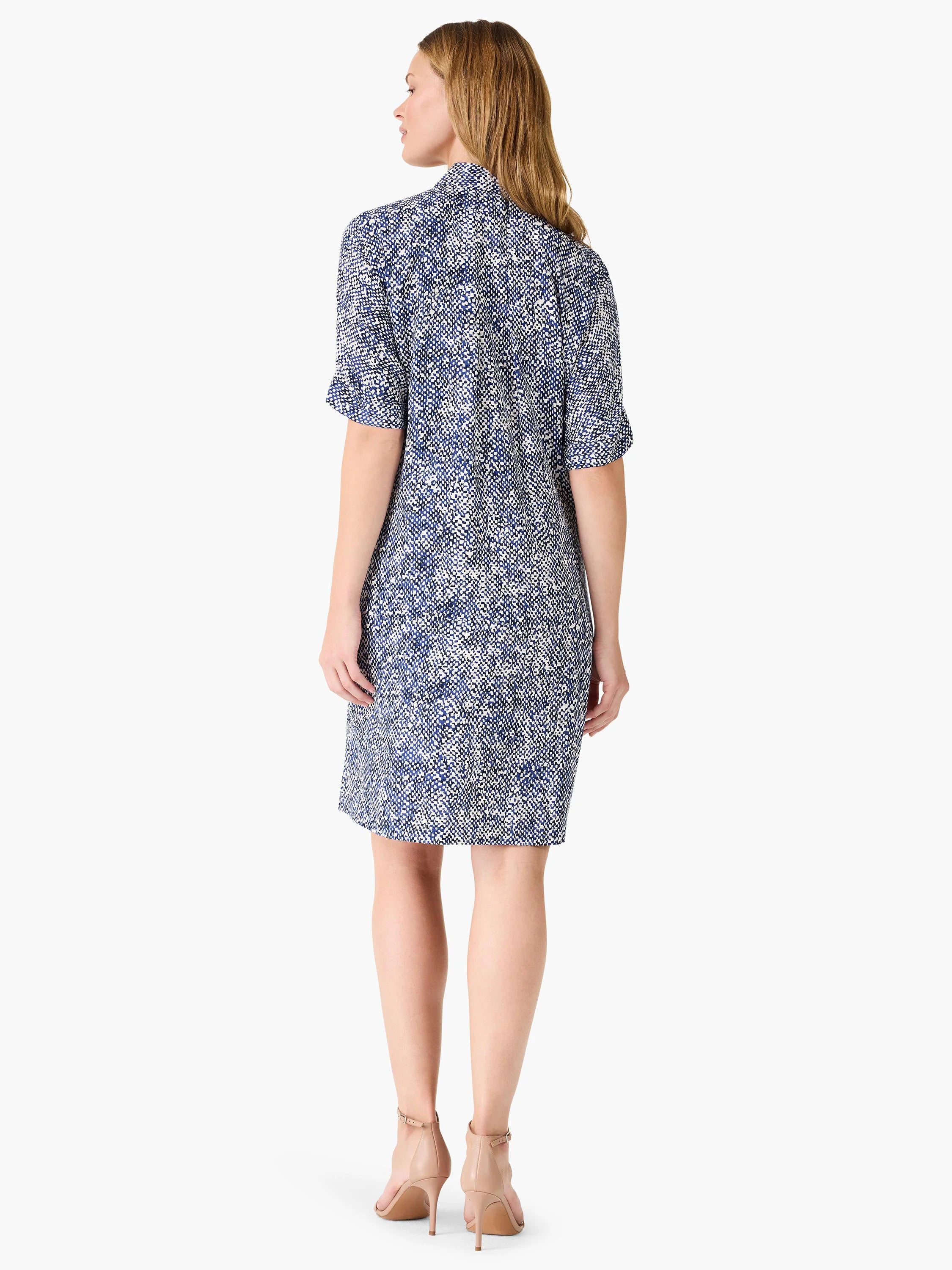 Here's alt text for the image, under 125 characters:
"Navy and white patterned knee-length dress, short sleeves, seen...