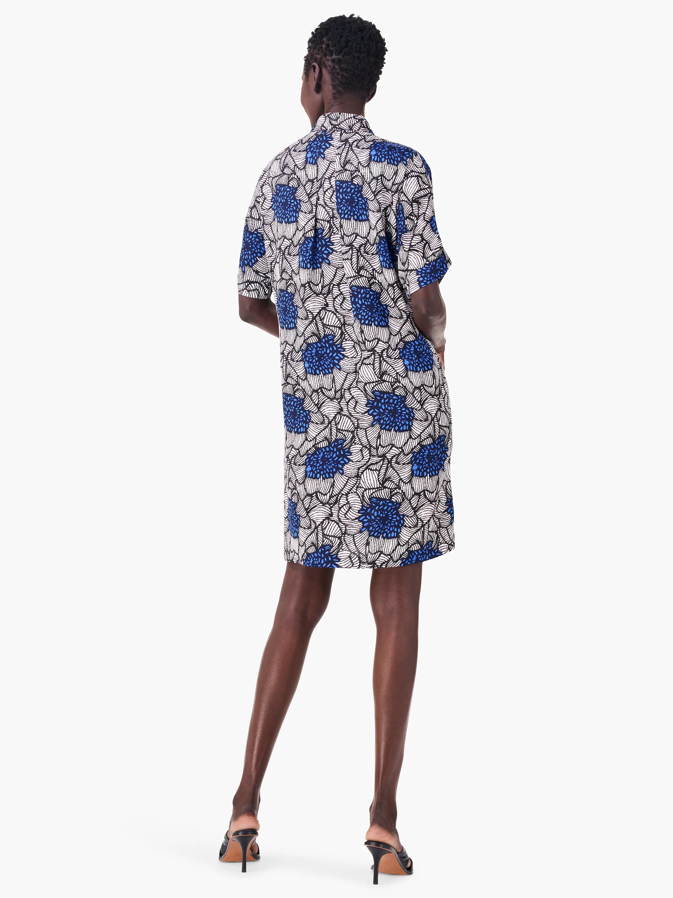 Here's alt text for the image, aiming for under 125 characters:
"Rear view of a short-sleeved knee-length dress. ...