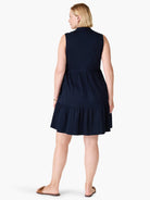 Here's alt text for the image, following the specifications:
"Navy blue sleeveless dress, tiered skirt, collared...