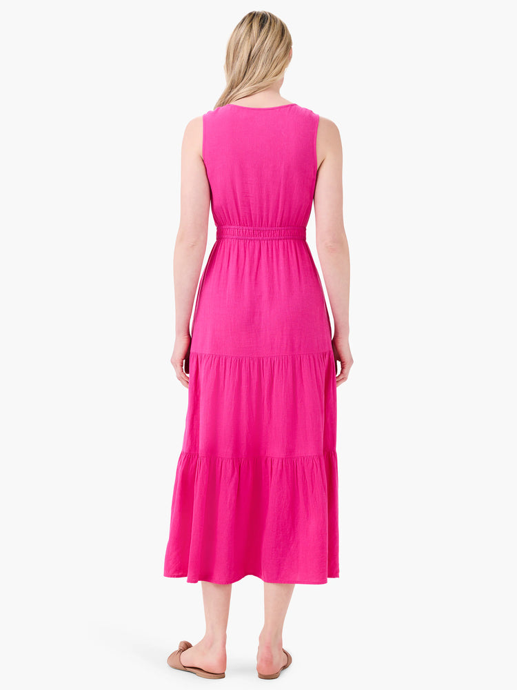 Pink sleeveless midi dress with tiered skirt and elasticized waist. Back view.