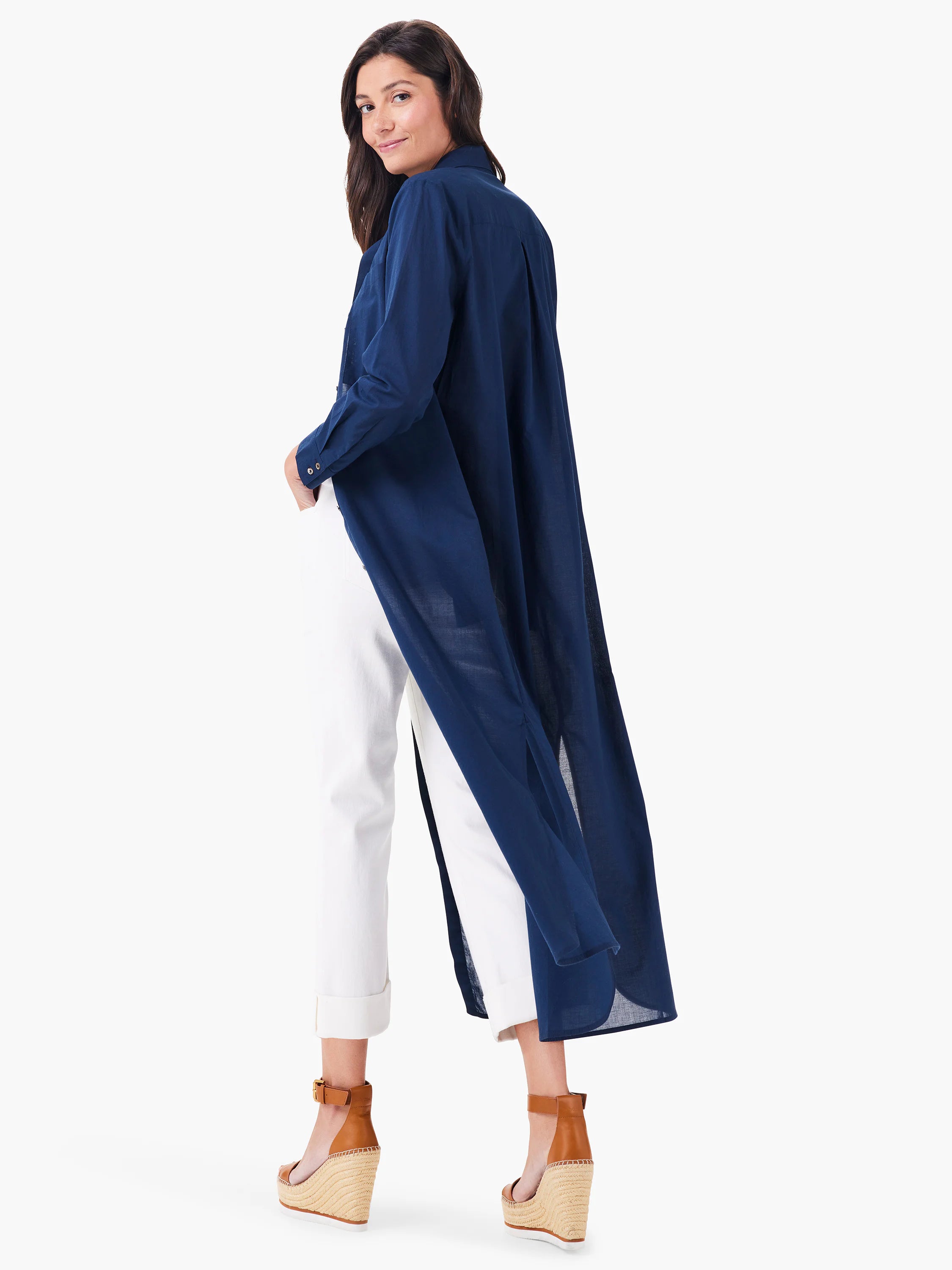 Navy blue, long-sleeved tunic; shirt-style collar; side slits; knee-length.