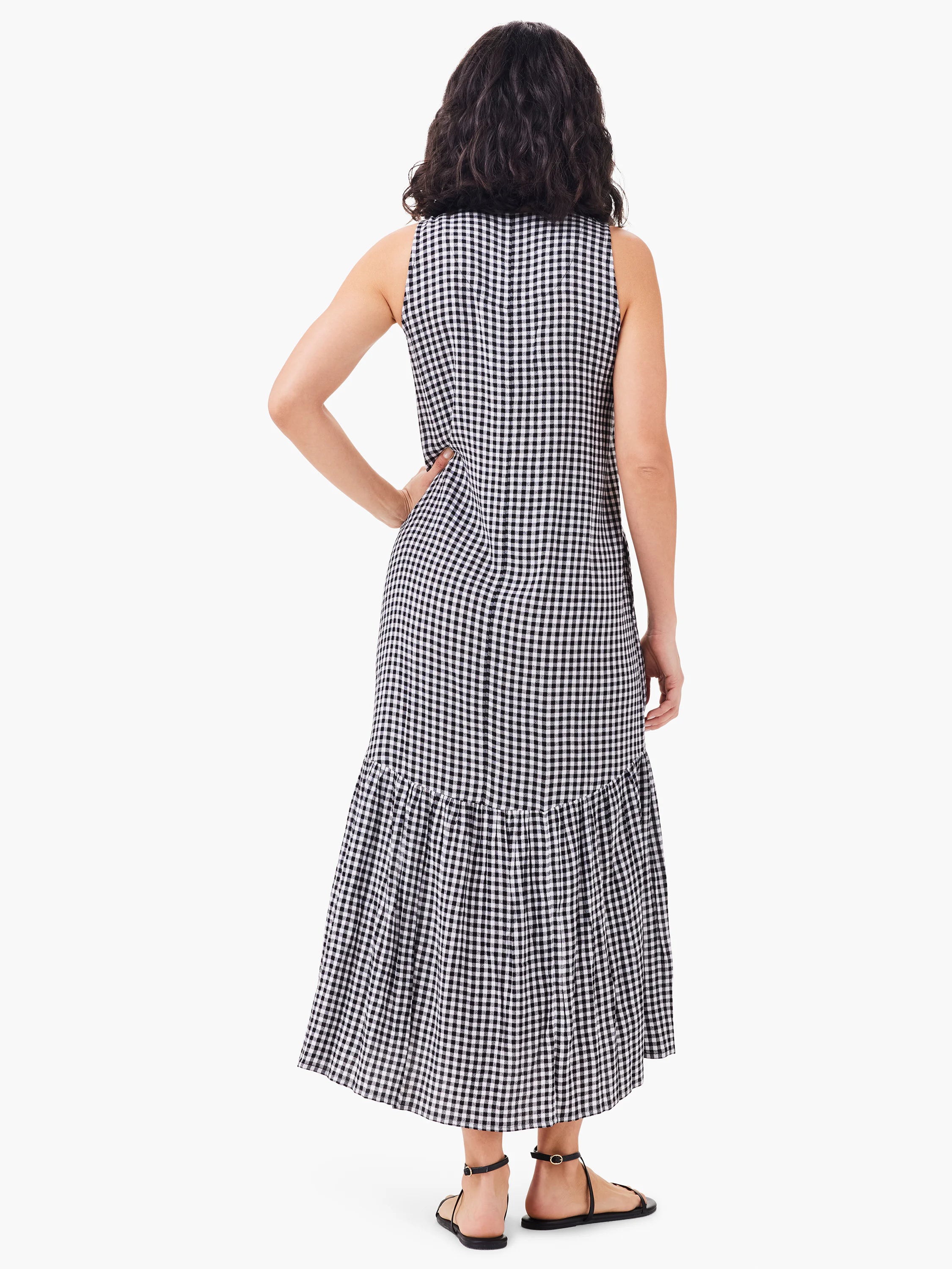 Black and white gingham sleeveless maxi dress with a tiered ruffle hem. Back view.