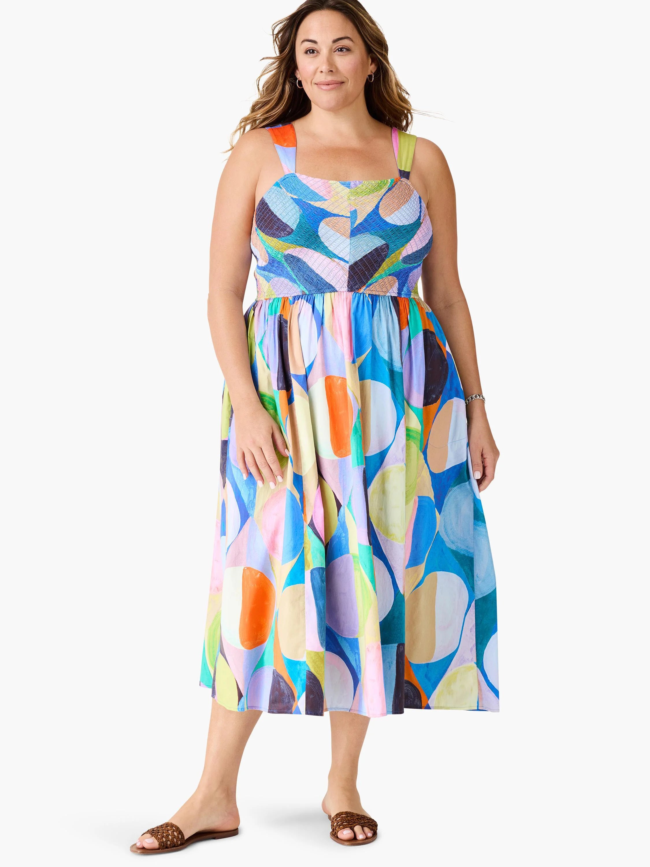 Midi dress, multicolored abstract print featuring blues, pinks, oranges, and greens. Sleeveless, fitted bodice, full skirt.