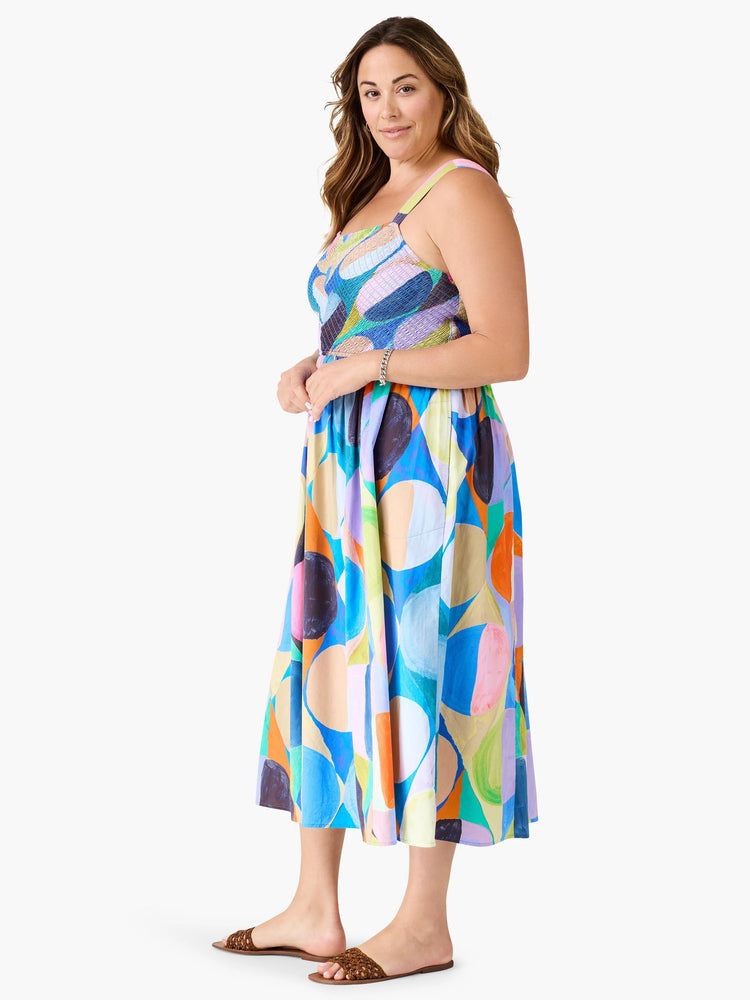 Midi dress, abstract print. Blues, oranges, pinks, purples & greens. Sleeveless, fitted bodice, full skirt.