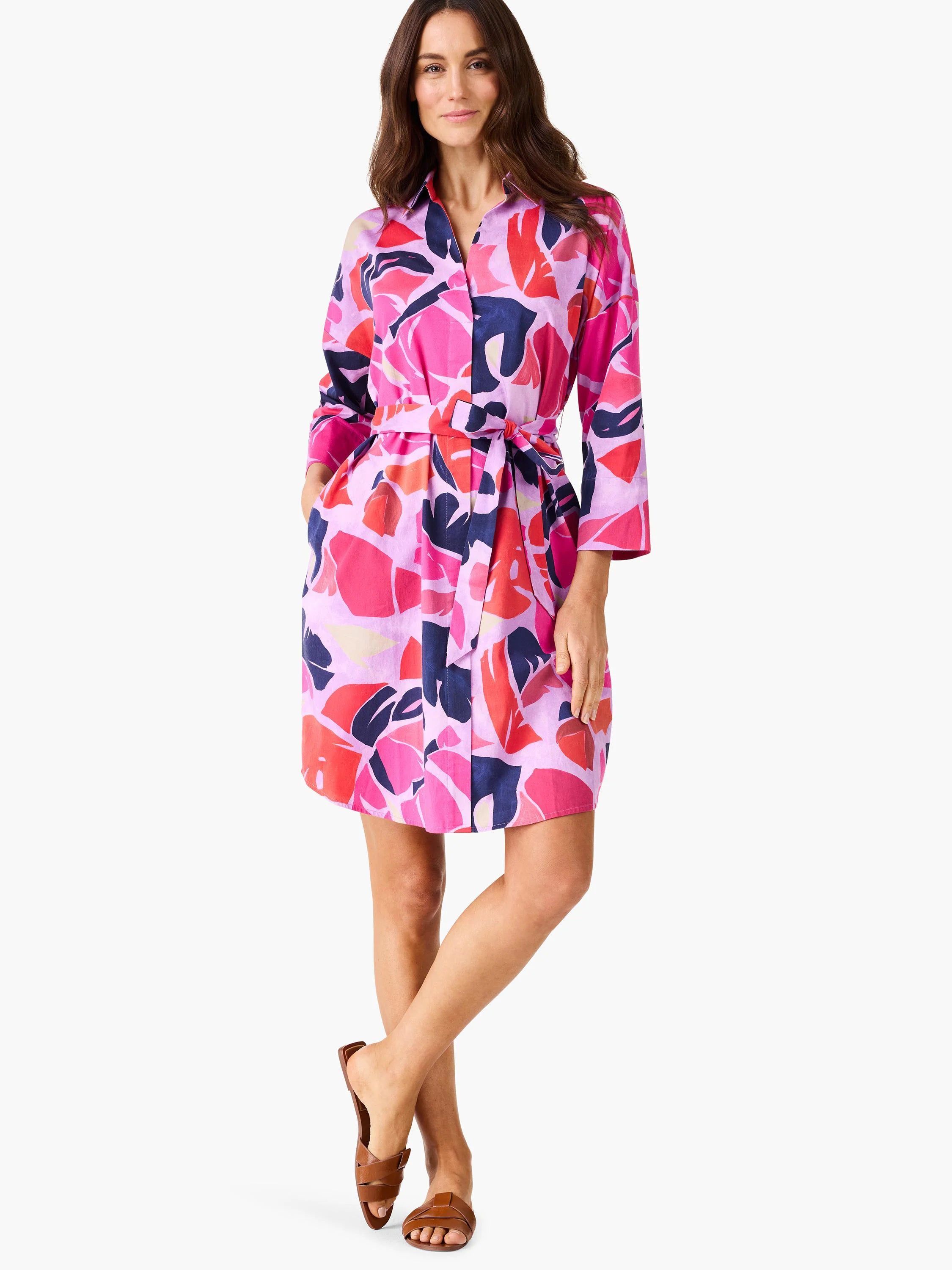 Pink, red, and navy abstract leaf print shirt dress with a belted waist. Three-quarter sleeves.