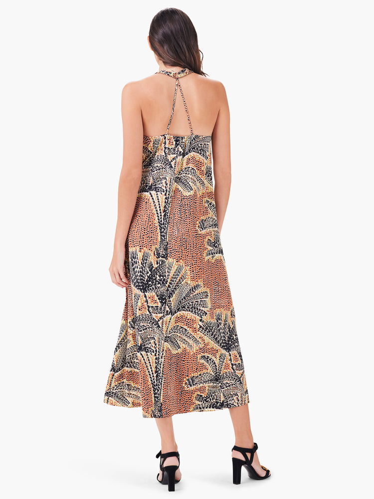 Brown, black, and beige midi halter dress with palm tree print. Open back.