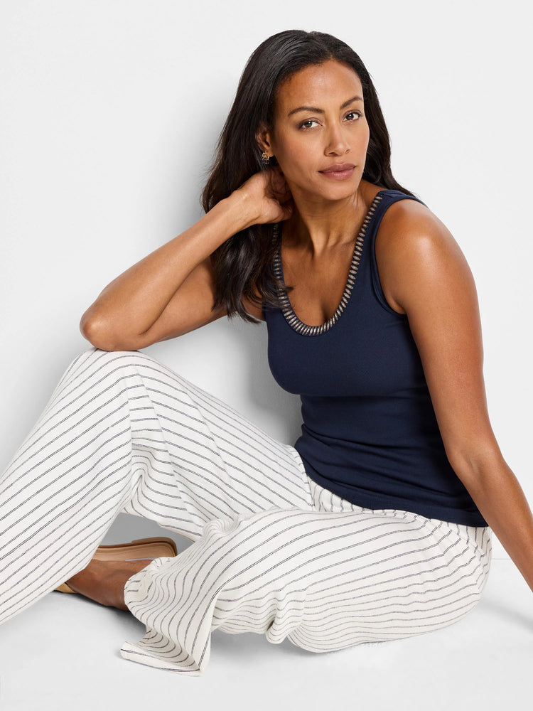 Navy blue ribbed tank top with metallic trim neckline.