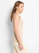 Light beige ribbed scoop tank, fitted, worn by model in profile.