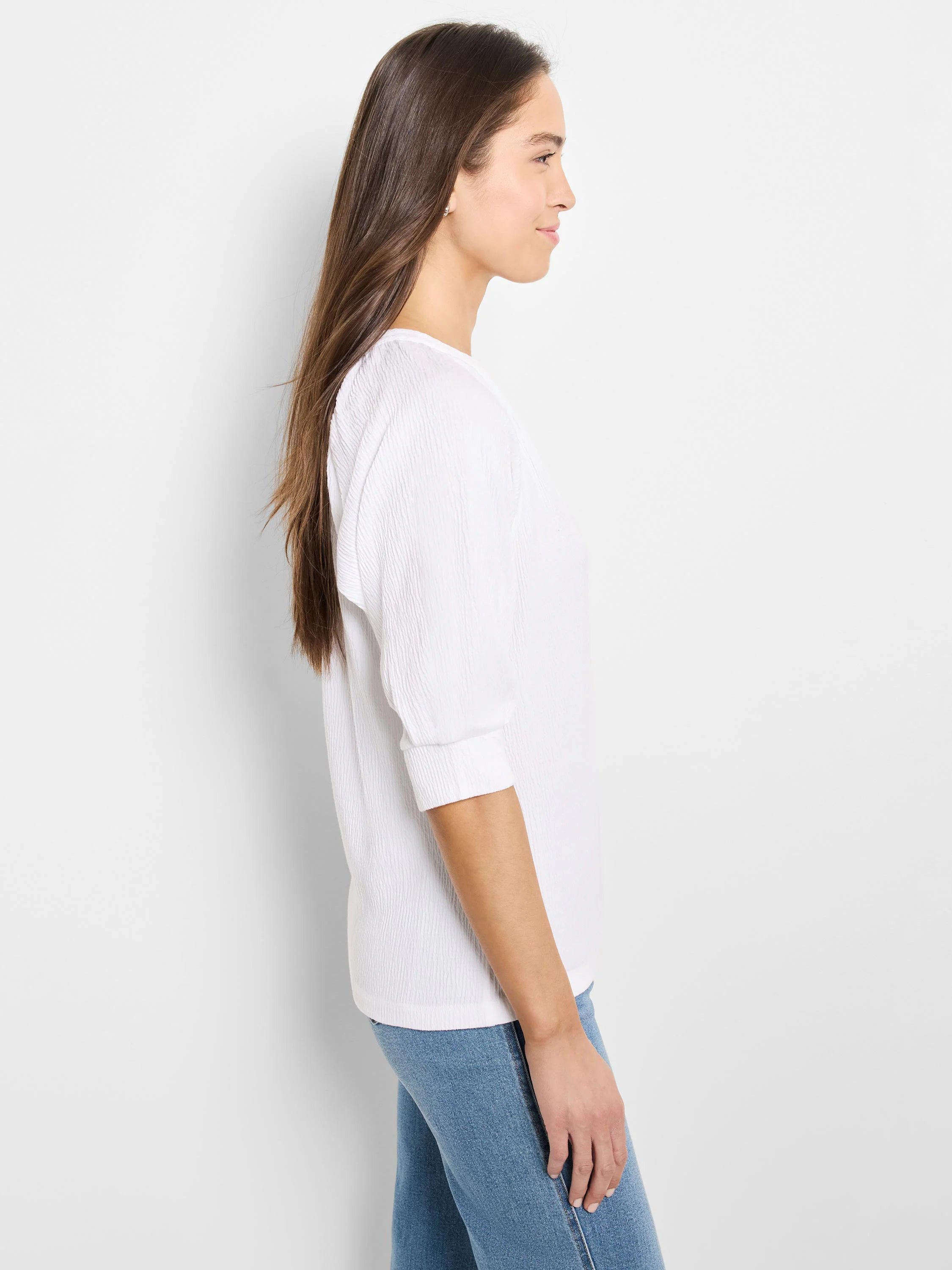 White, textured knit top with 3/4 sleeves. Side profile shown.