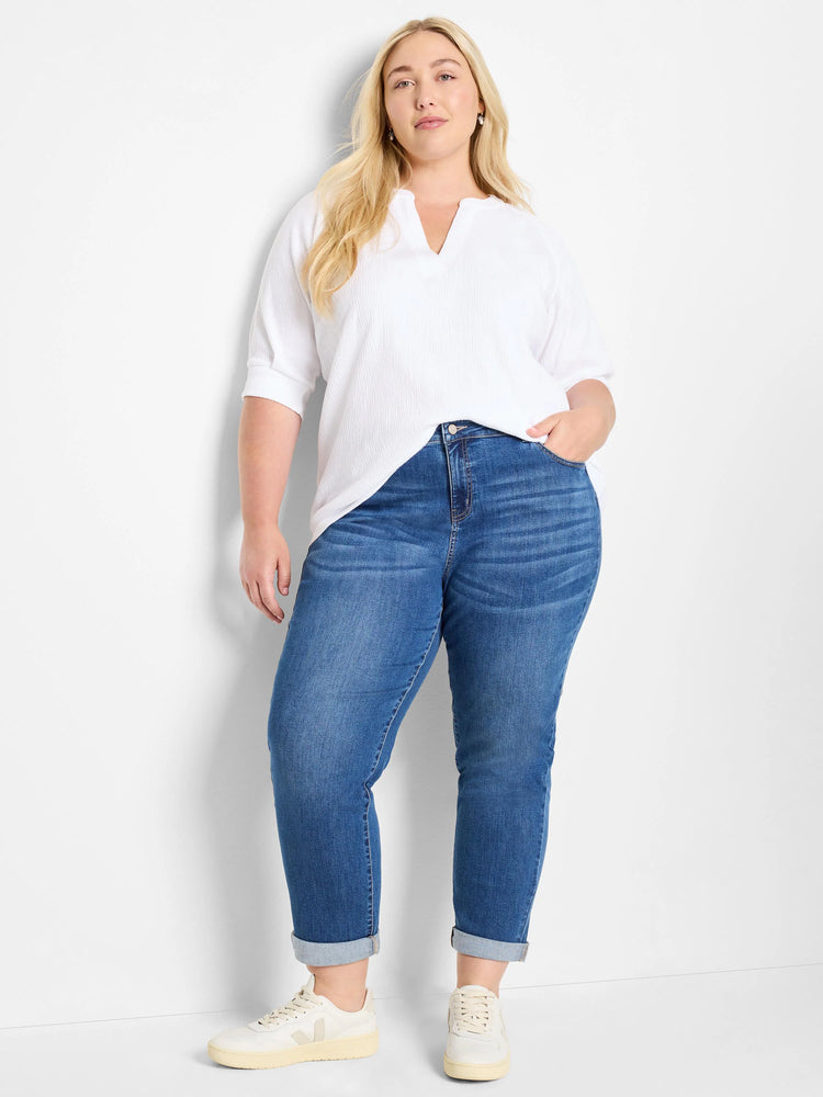 White crinkle knit top with V-neck and short sleeves.