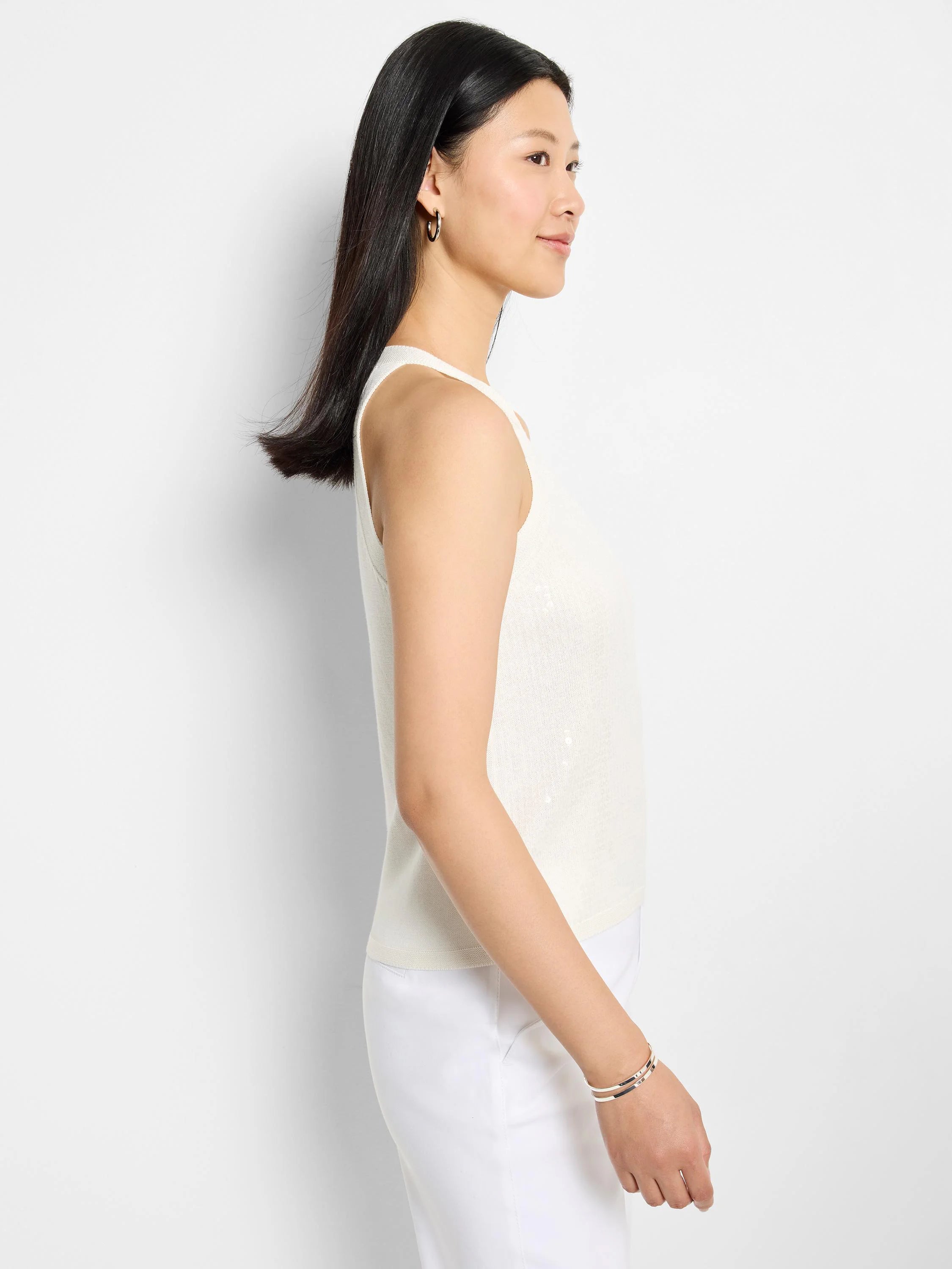 Off-white sleeveless sweater tank with subtle, scattered sequins.