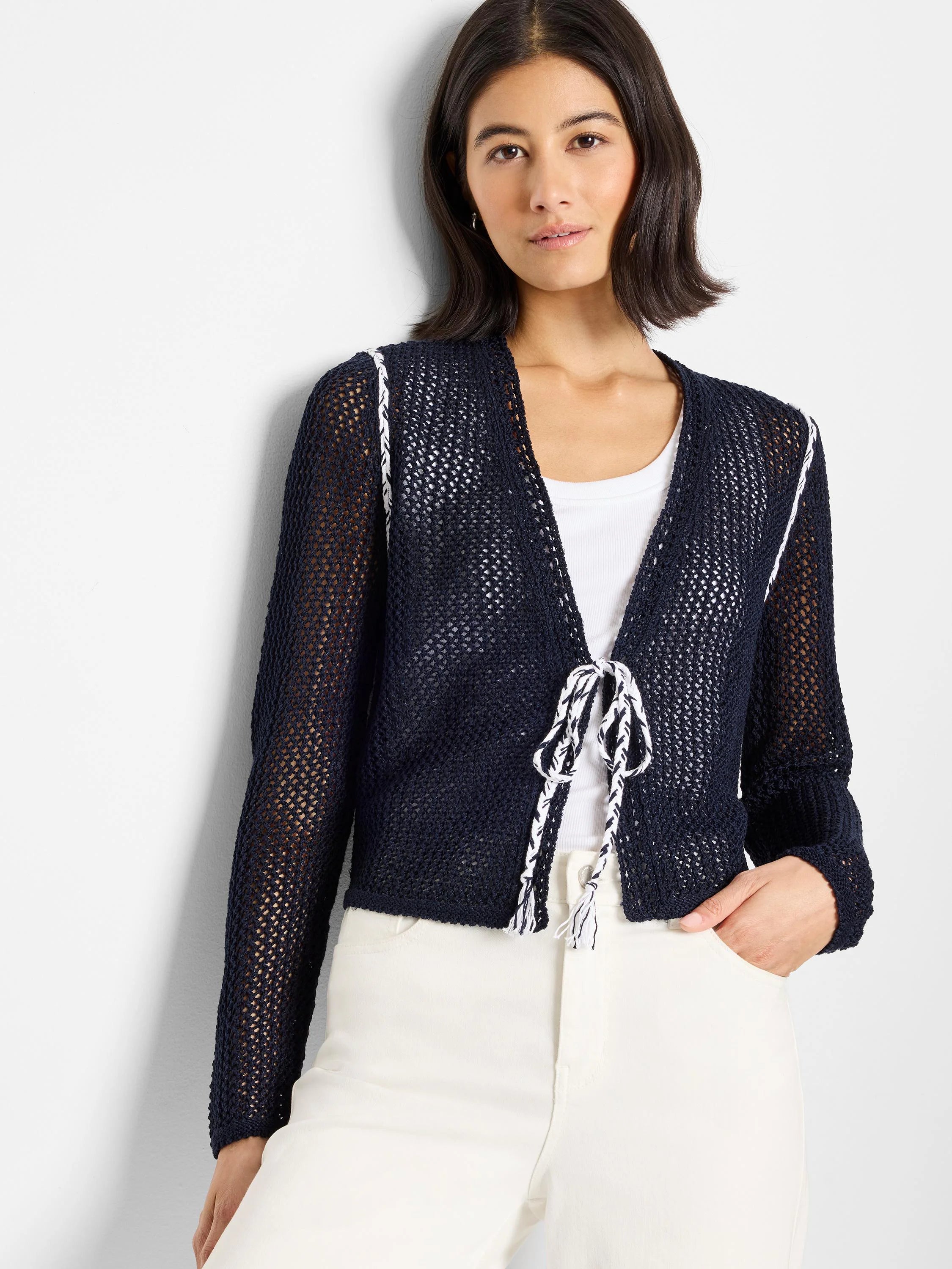 Navy blue mesh tie cardigan with white trim and ties.  Open front.