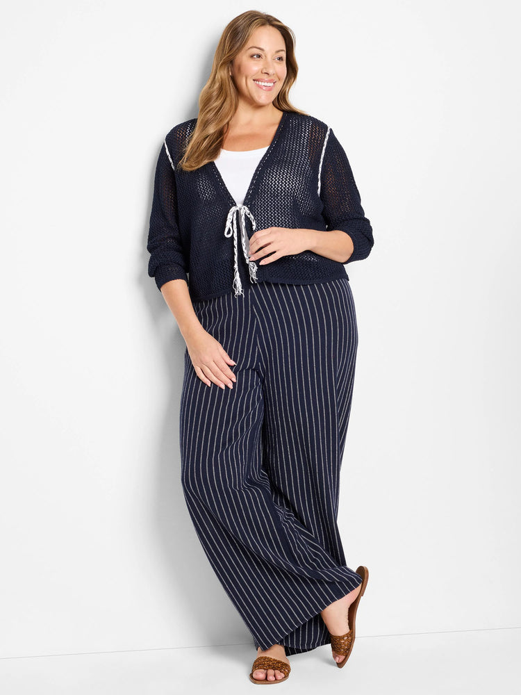 Navy blue mesh cardigan with white trim and ties. Three-quarter sleeves.