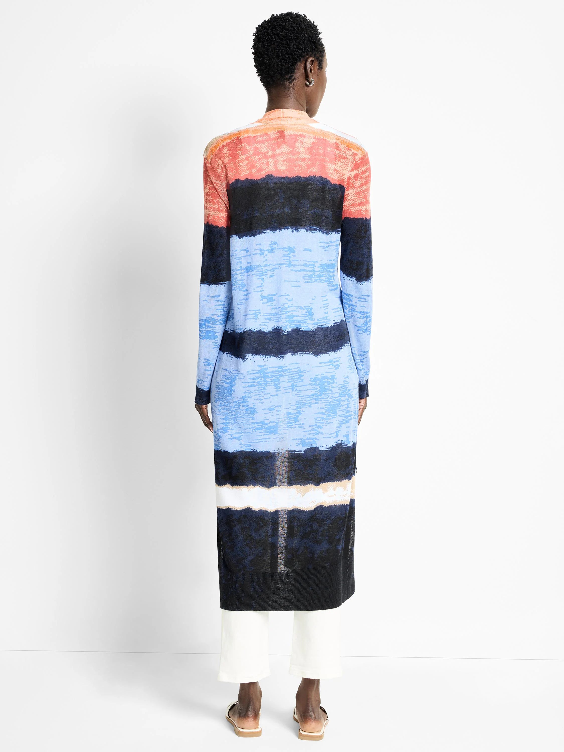 Long, open cardigan; horizontal stripes in coral, light blue, dark blue, and black. Textured knit.