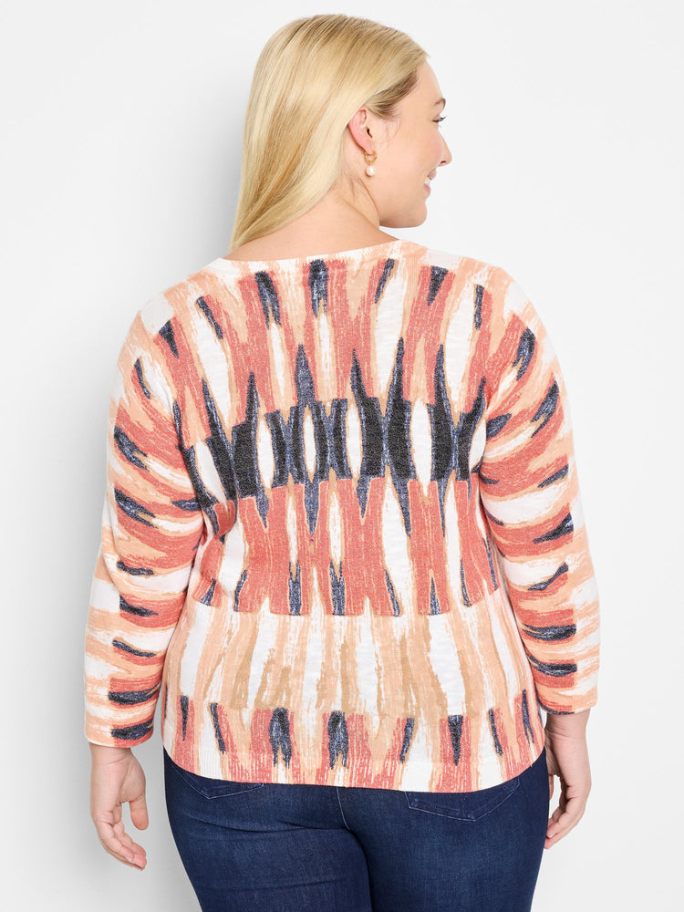Here's alt text for the image, under 125 characters:
"Crisscross cotton sweater, rear view. Features a cream base with...