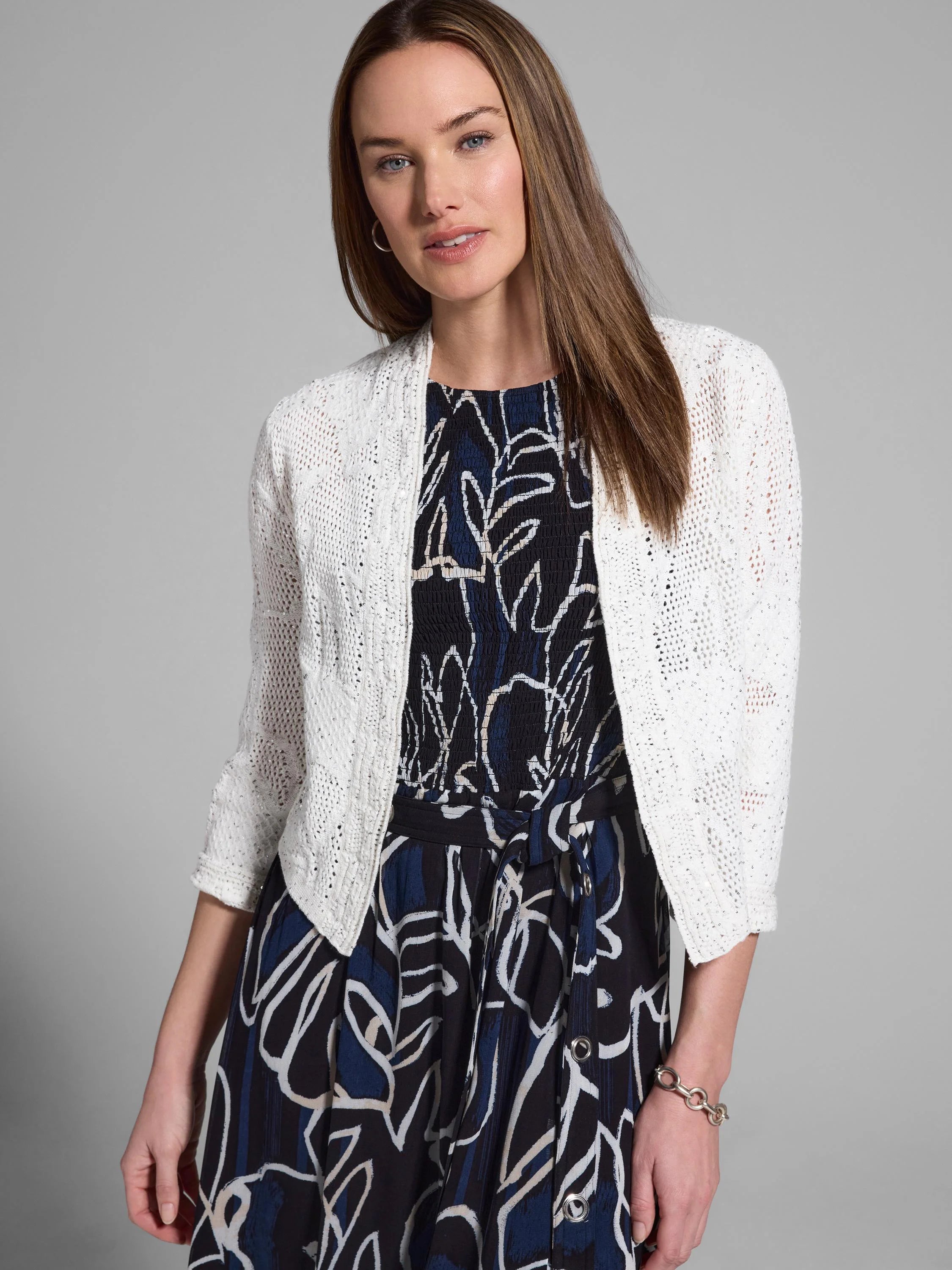 Off-white open-weave sequin cardigan, 3/4 sleeves.  Subtle sparkle.