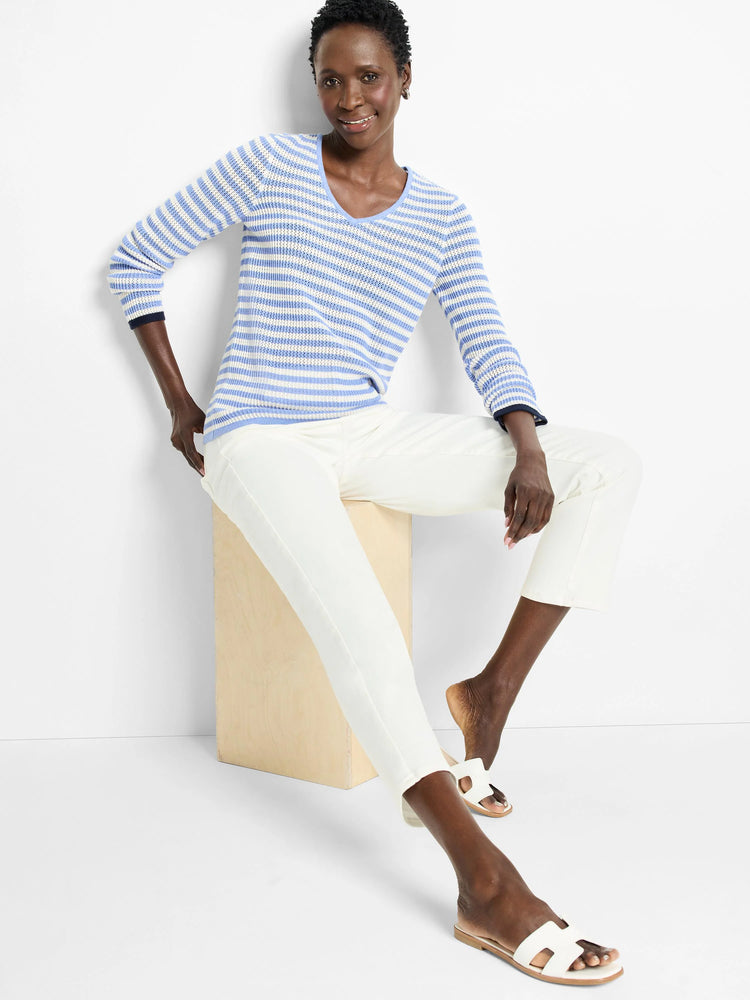 Light blue and white horizontal striped, long-sleeved V-neck sweater. Mesh knit.