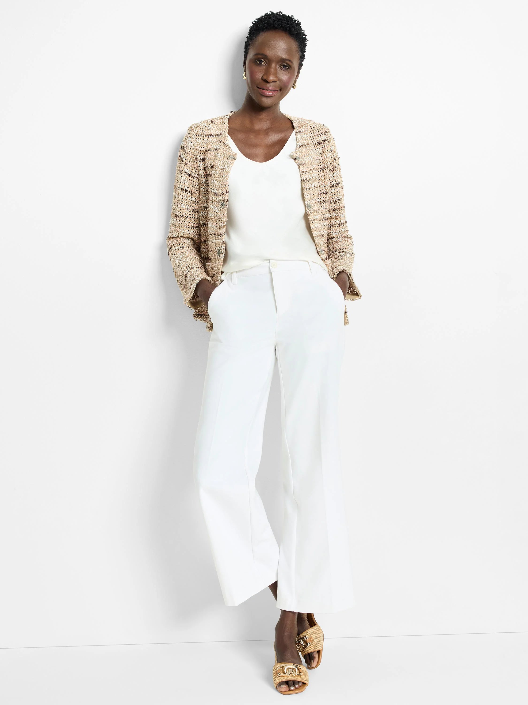 Beige, brown, and white knit jacket.  Open front, three-quarter sleeves.