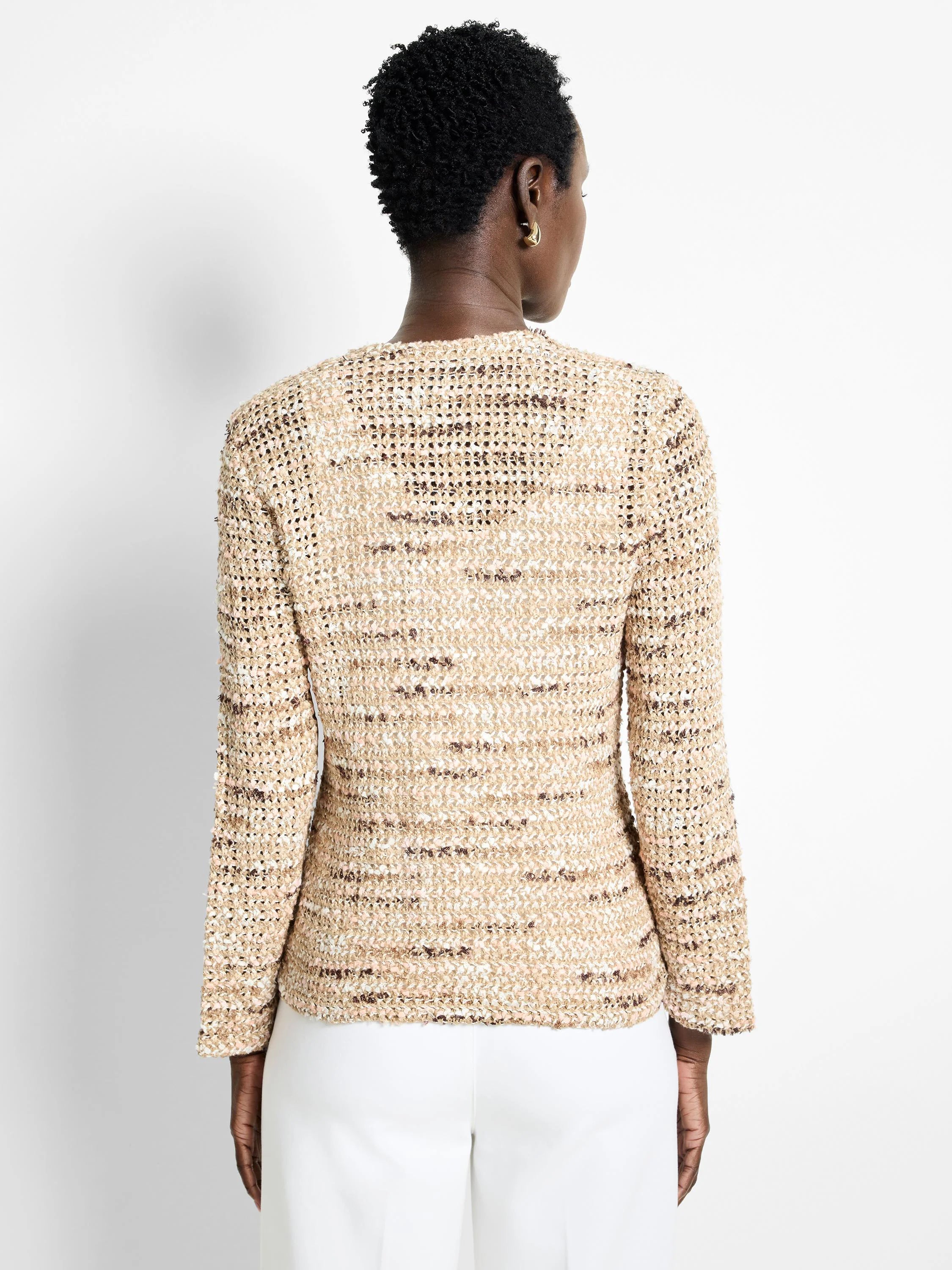 Beige knit jacket with brown and white flecks, long sleeves, and a textured appearance.