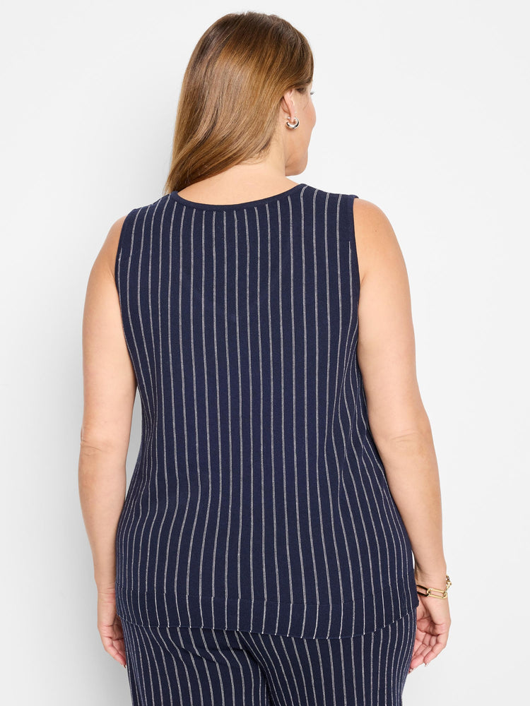 Here's alt text for the image, under 125 characters:
"Navy blue sleeveless knit tank with thin white vertical stripes. ...