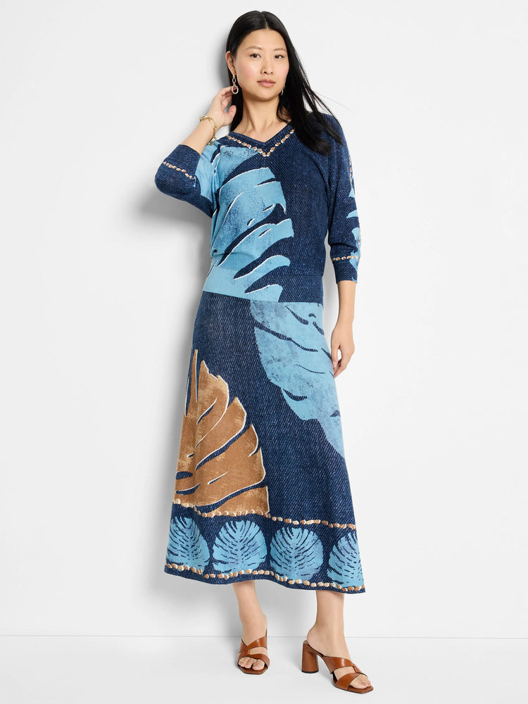 Navy blue and light blue sweater and midi skirt with brown leaf print; V-neck, 3/4 sleeves, detailed hemline.