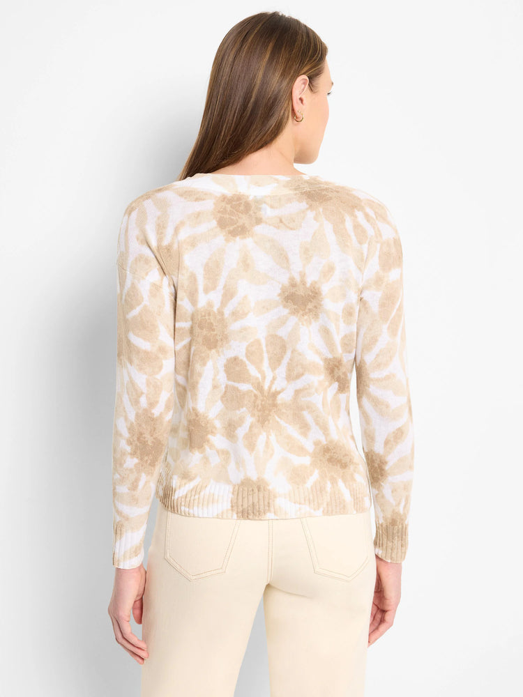 Beige sweater with a light brown floral tie-dye pattern. Long sleeves, ribbed hem.