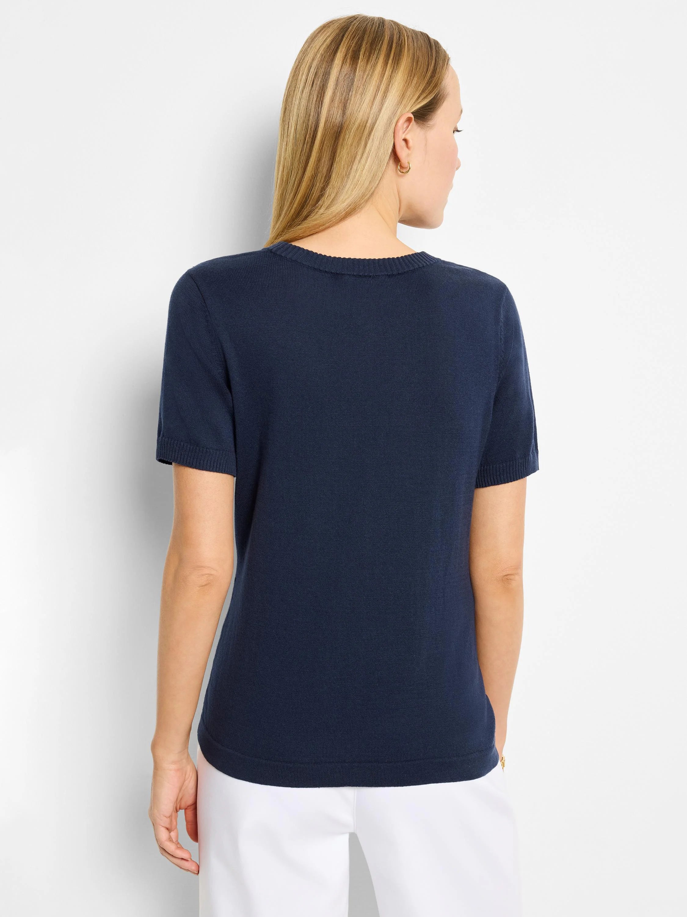 Navy blue, short-sleeved scoop neck cotton sweater tee. Back view.