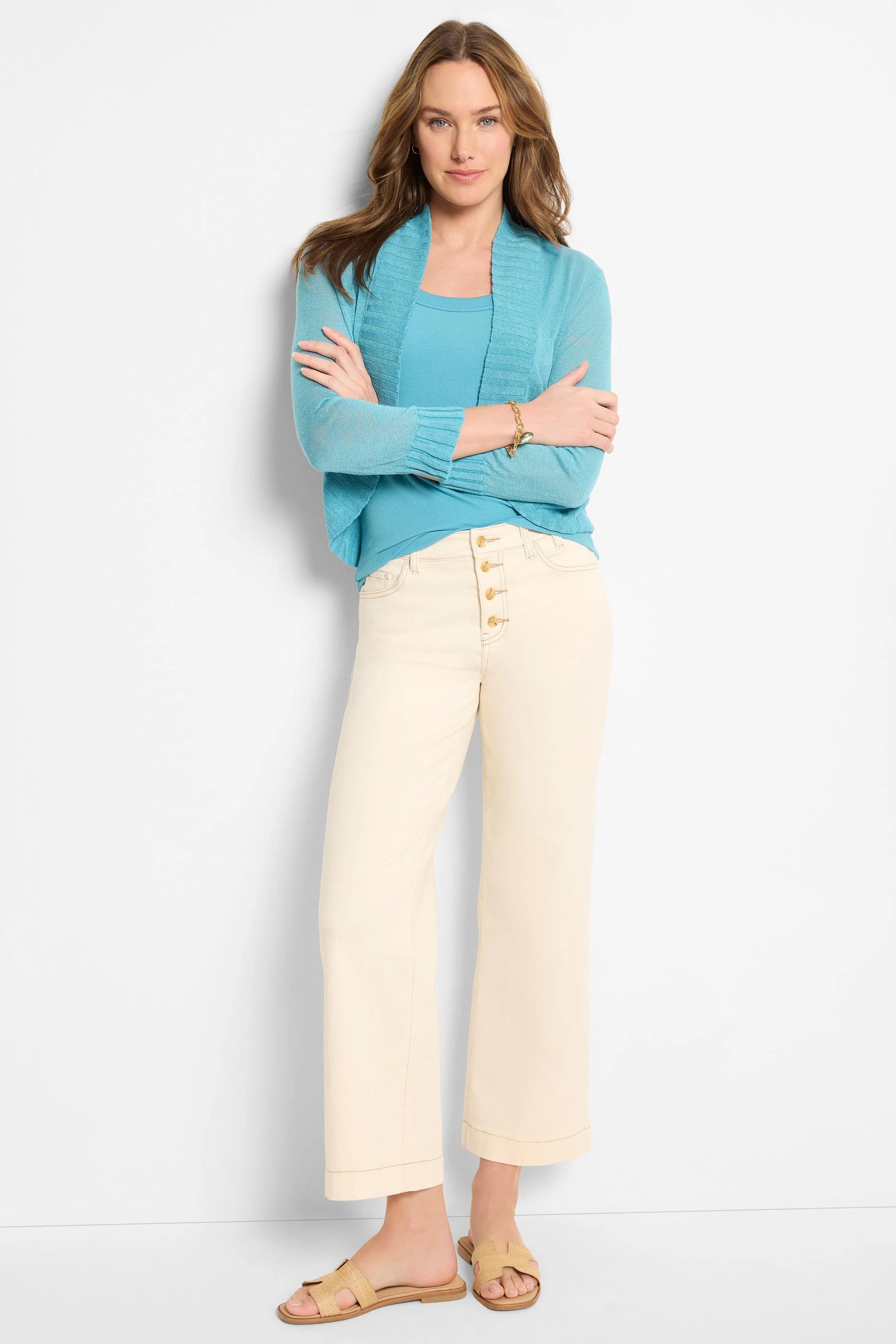 Light aqua open-front bolero cardigan with long sleeves and ribbed cuffs.