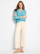 Light aqua open-front bolero cardigan with long sleeves and ribbed cuffs.
