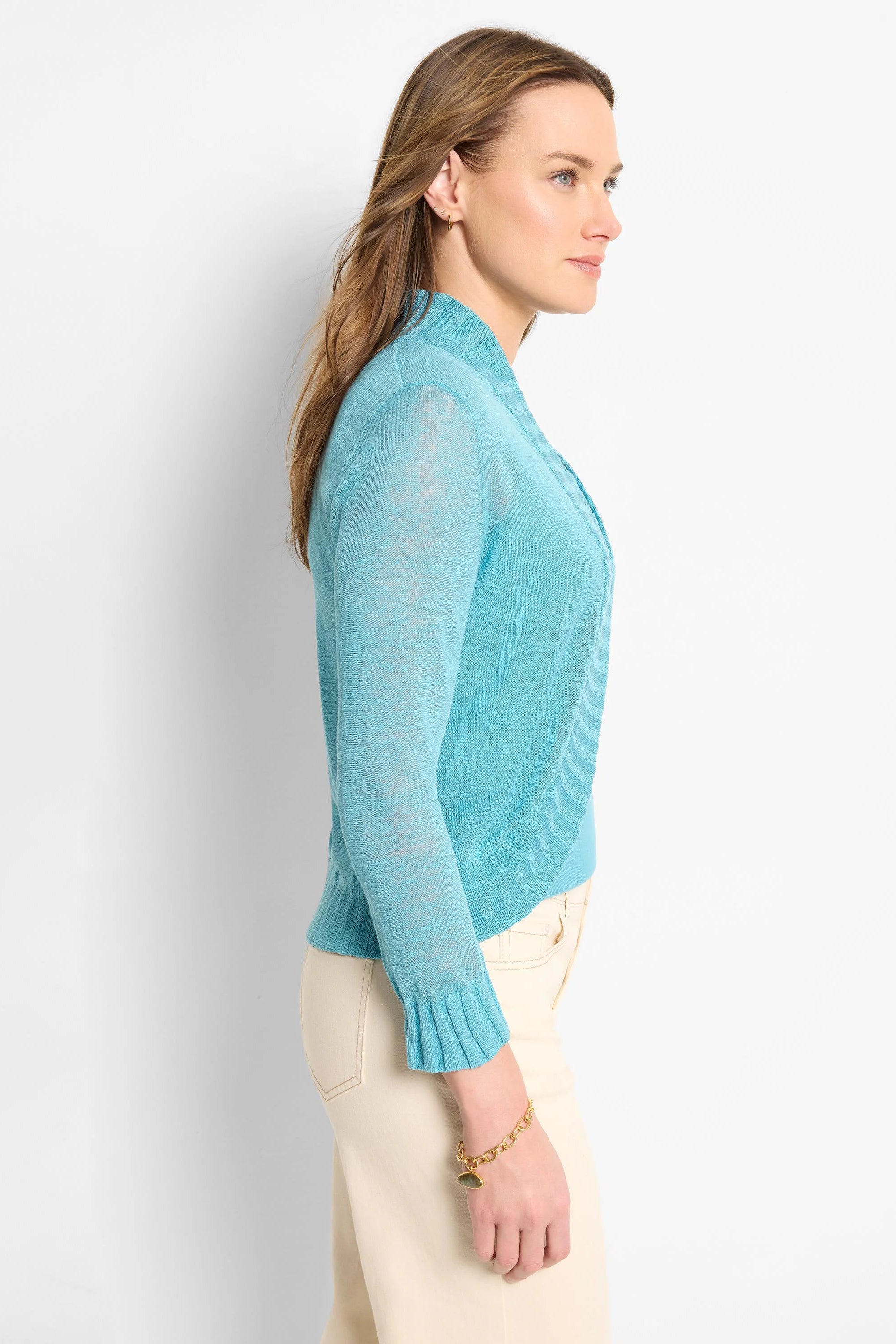 Aqua blue bolero cardigan, sheer knit, long sleeves with ribbed cuffs, open front design.