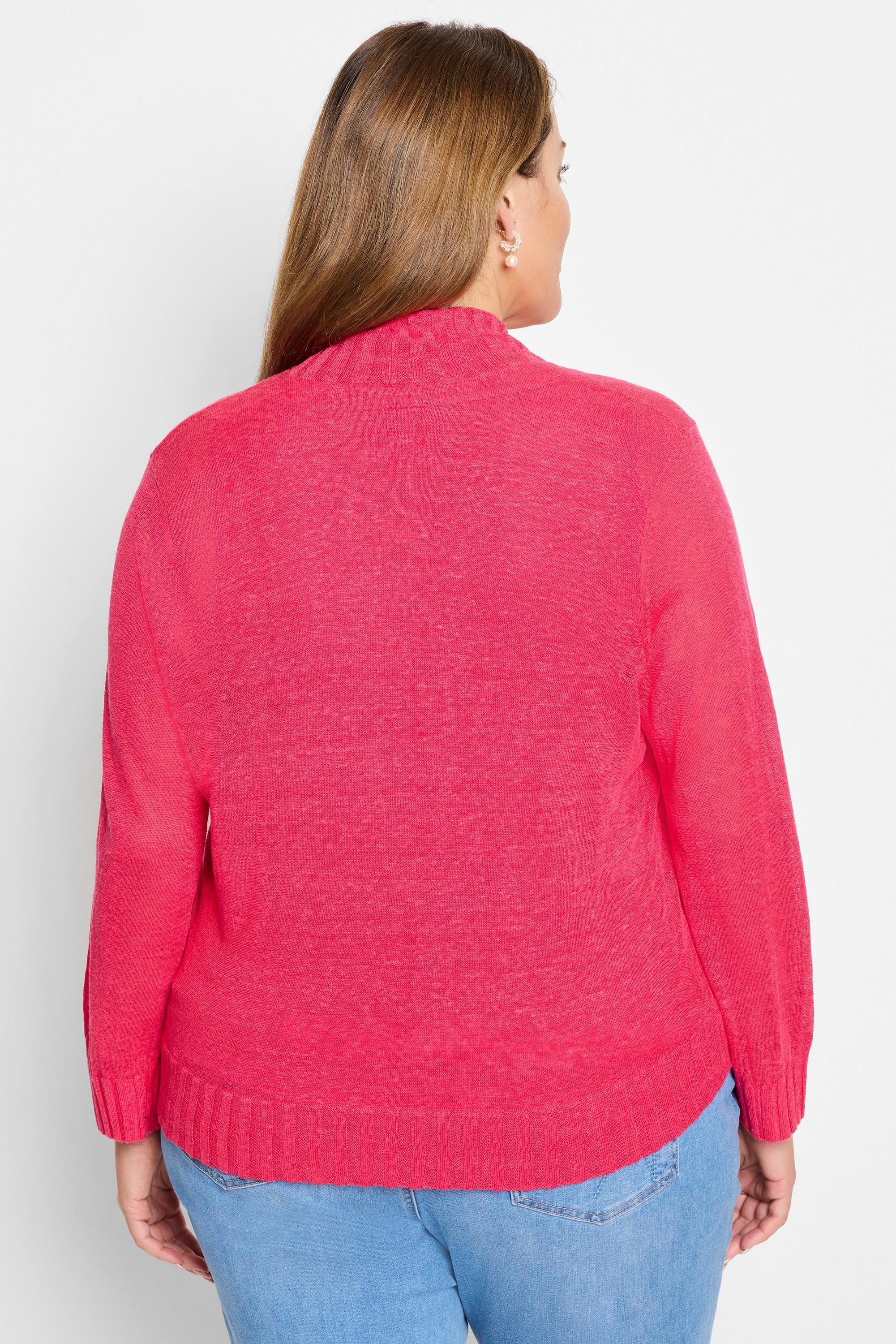 Raspberry knit bolero cardigan with long sleeves, ribbed mock neck, cuffs, and hem. Back view.
