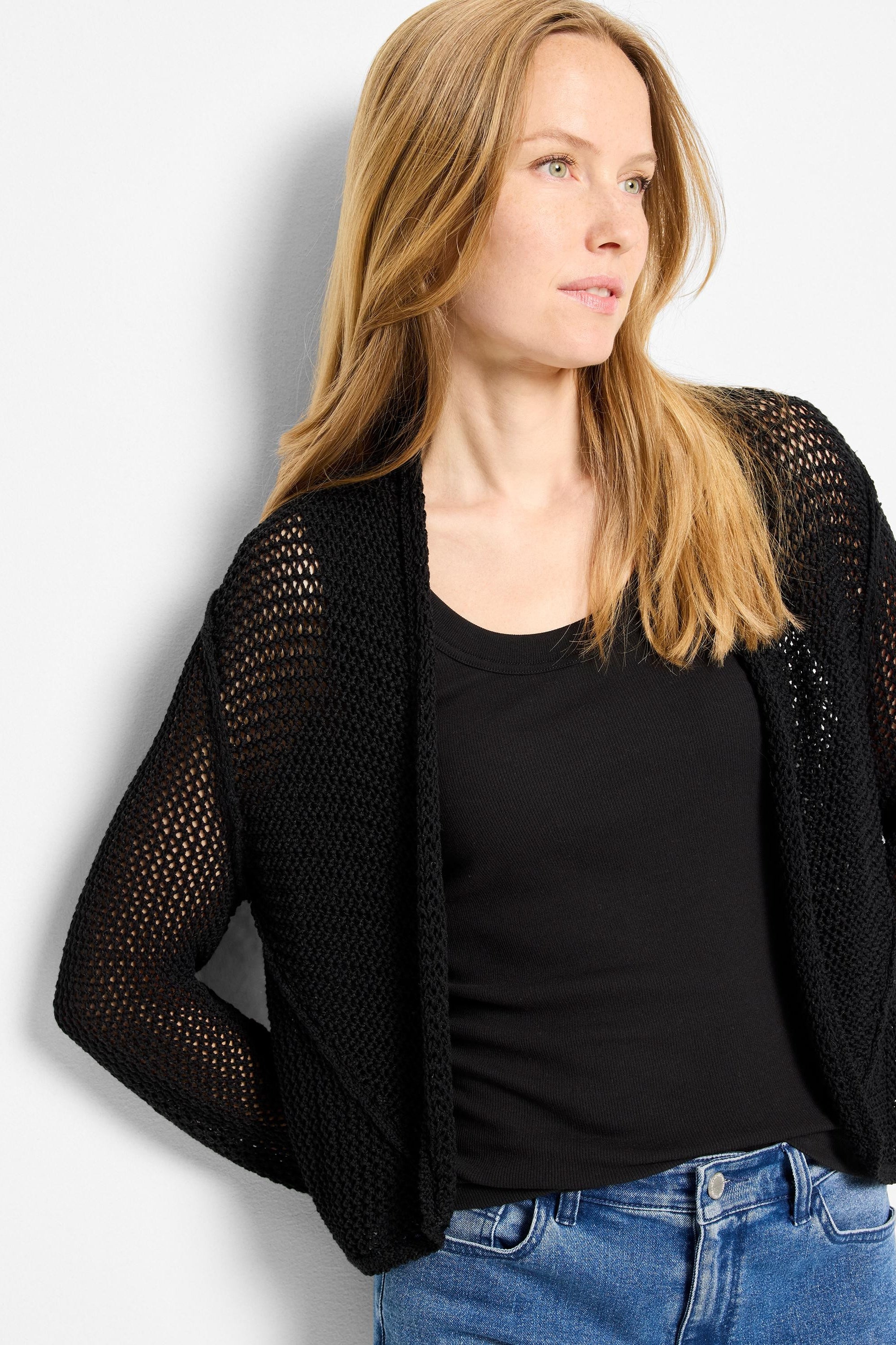 Black mesh open-front cardigan with a loose, cocoon-style fit.