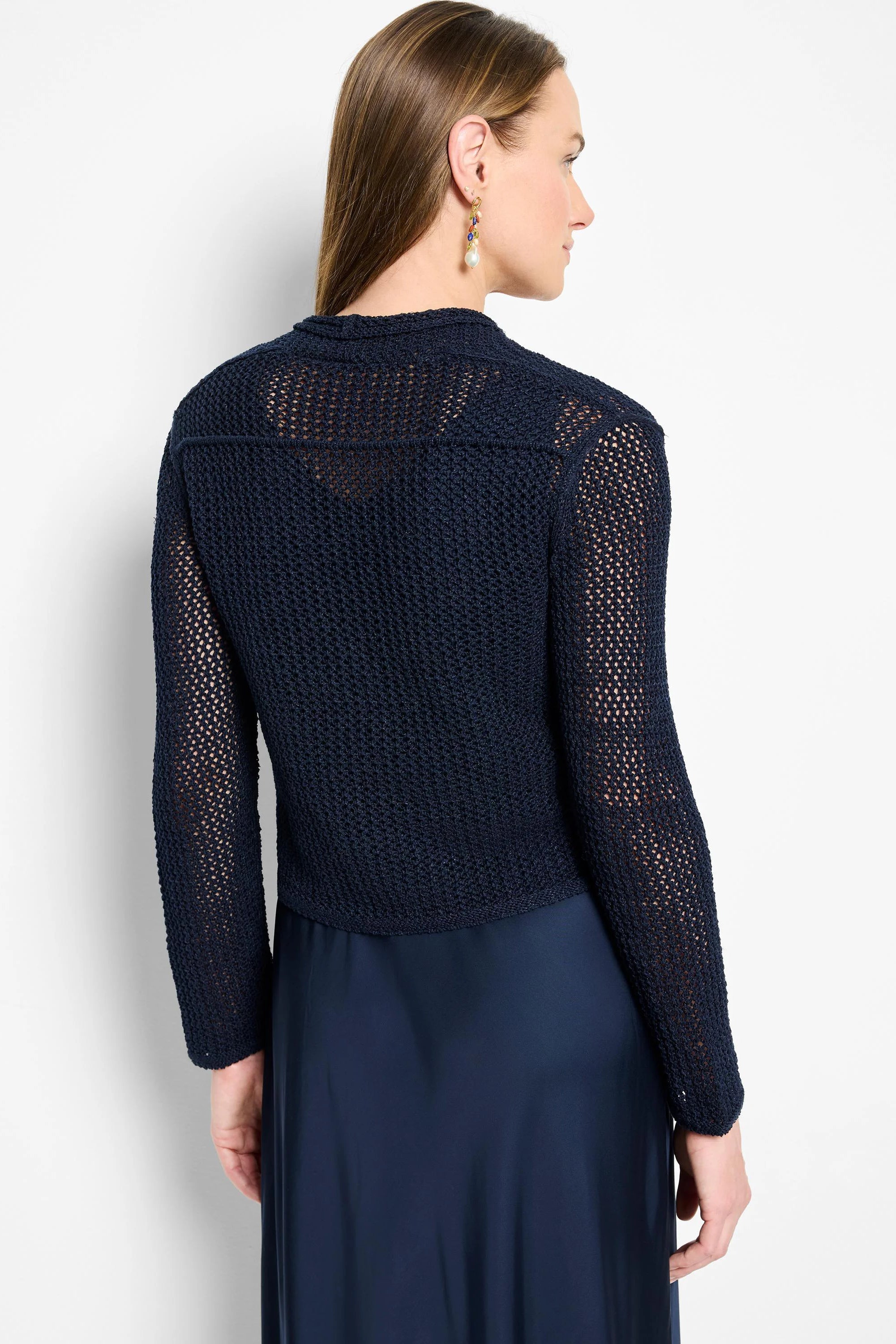 Navy open-knit mesh cardigan with long sleeves, worn by model.