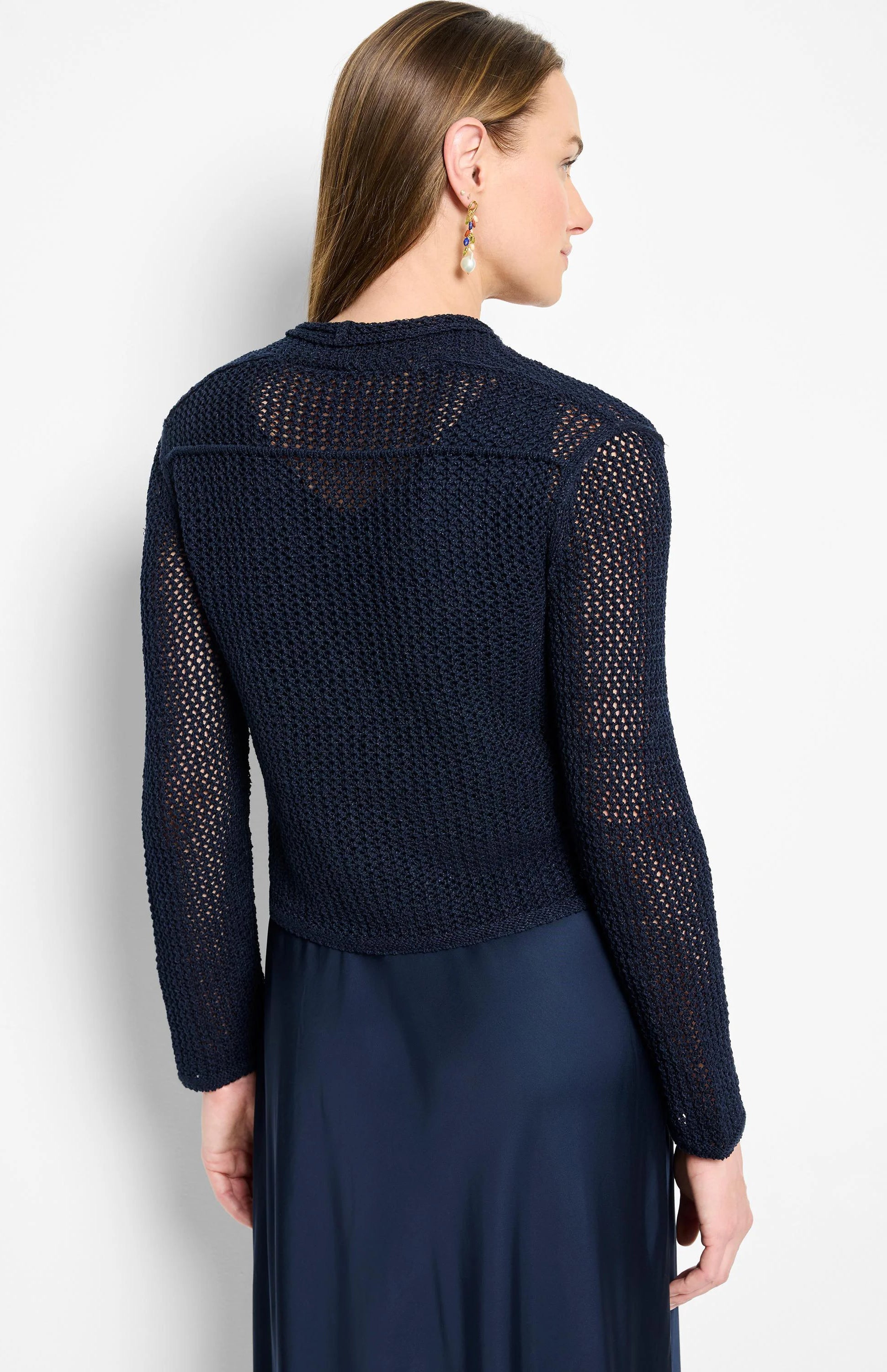 Navy open-knit mesh cardigan with long sleeves, worn by model.