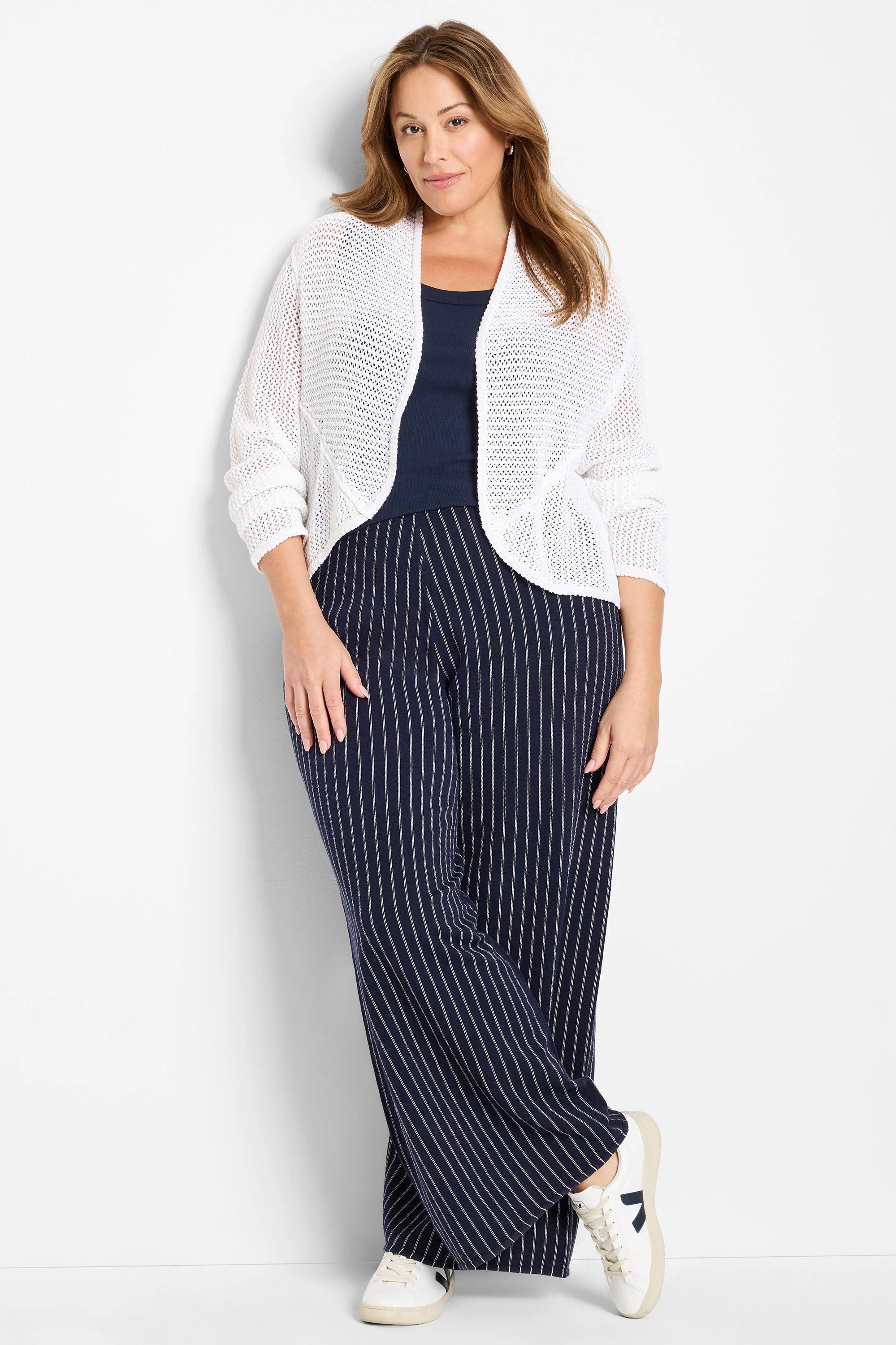 White mesh cocoon cardigan, open-front, with a visible open weave and draped fit.