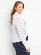 White mesh cocoon cardigan with a loose, open knit.