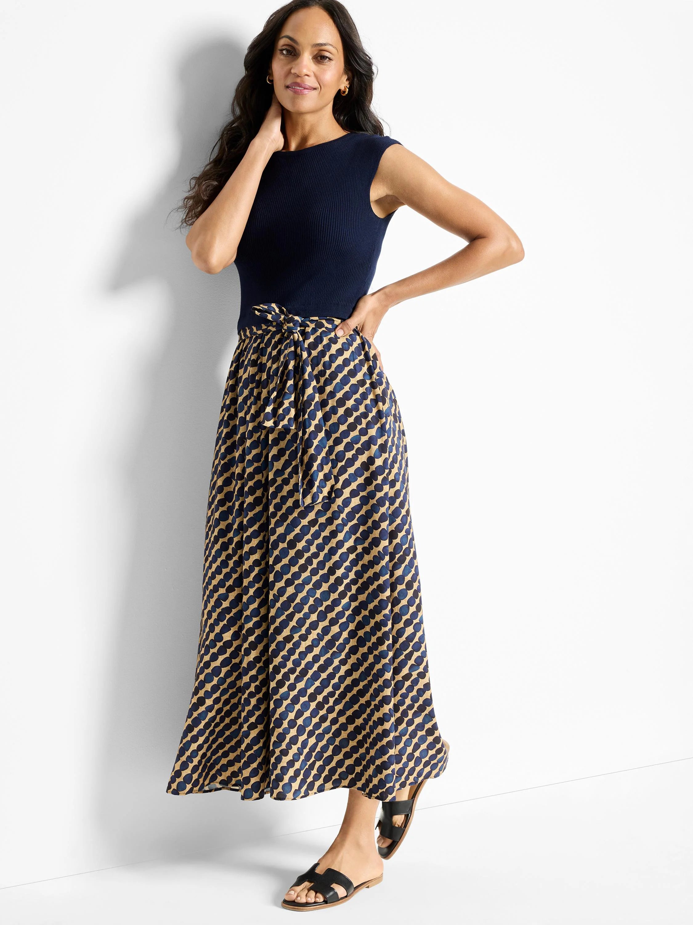 Navy blue ribbed top, tan and navy blue patterned maxi skirt with a self-tie belt.