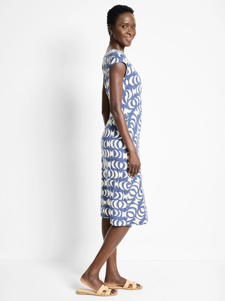 Knee-length dress, blue and off-white crescent moon pattern, short sleeves, boat neck.