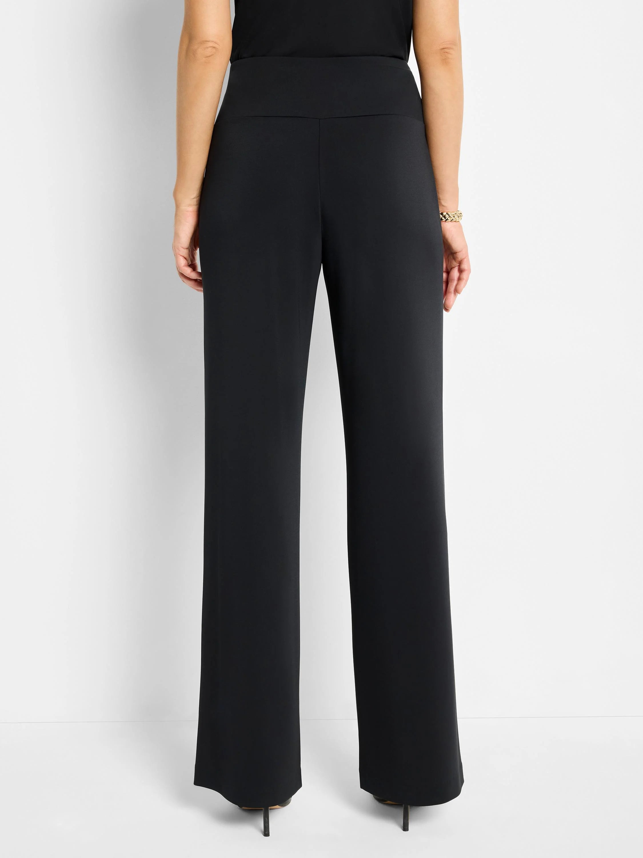 Black wide-leg pants; high-waisted, solid color, straight legs.