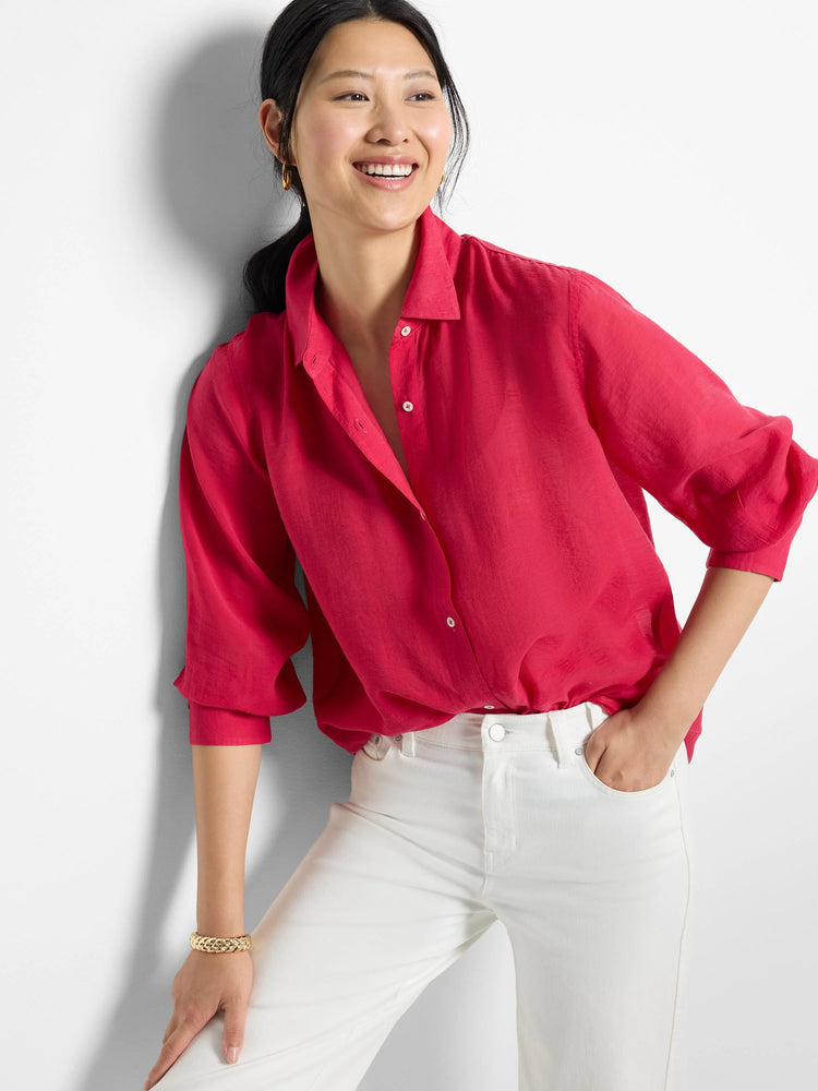 Pink, collared, 3/4 sleeve button-down shirt. Slight A-line shape.