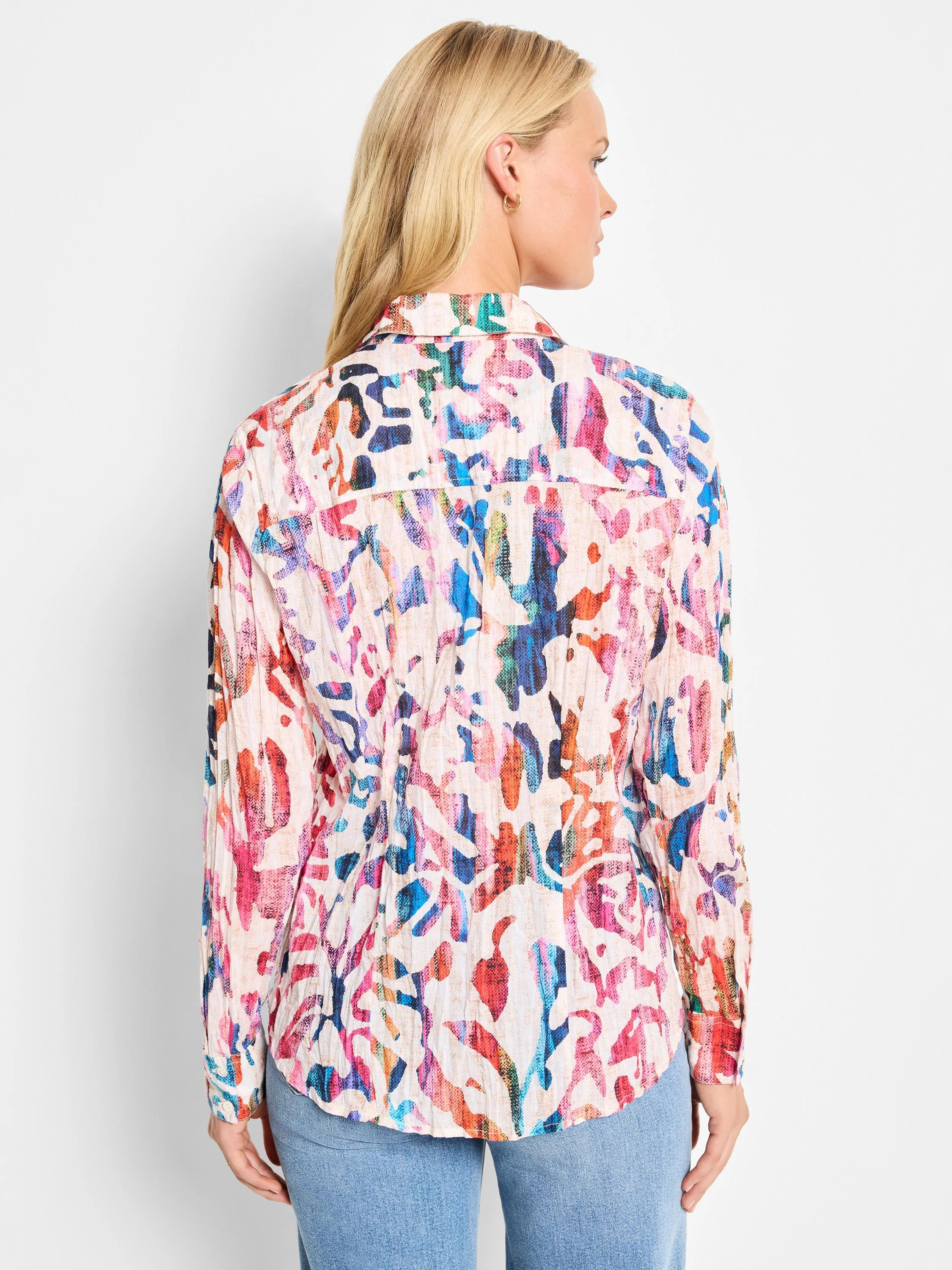 Cream cotton shirt; multicolored abstract print with pink, red, blue, and orange.  Long sleeves, collared.